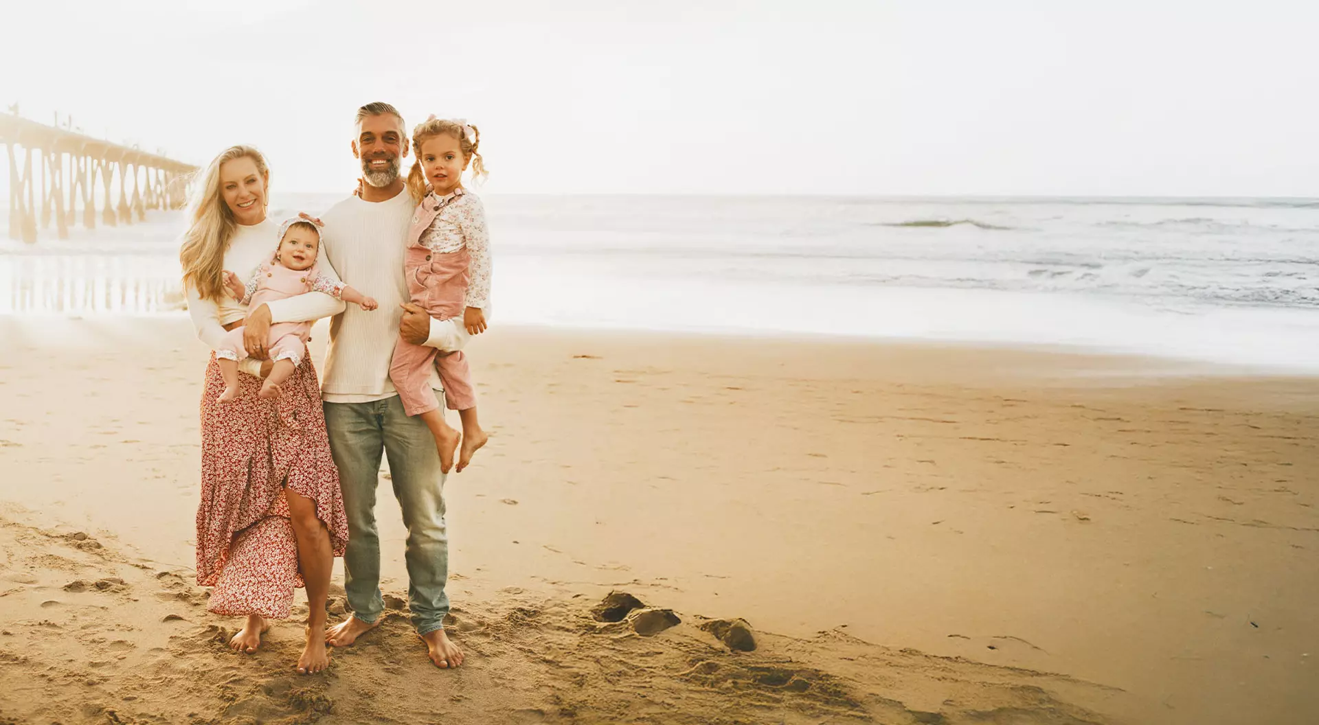 Amber Pfister and her family pose on Hermosa Beach in California.