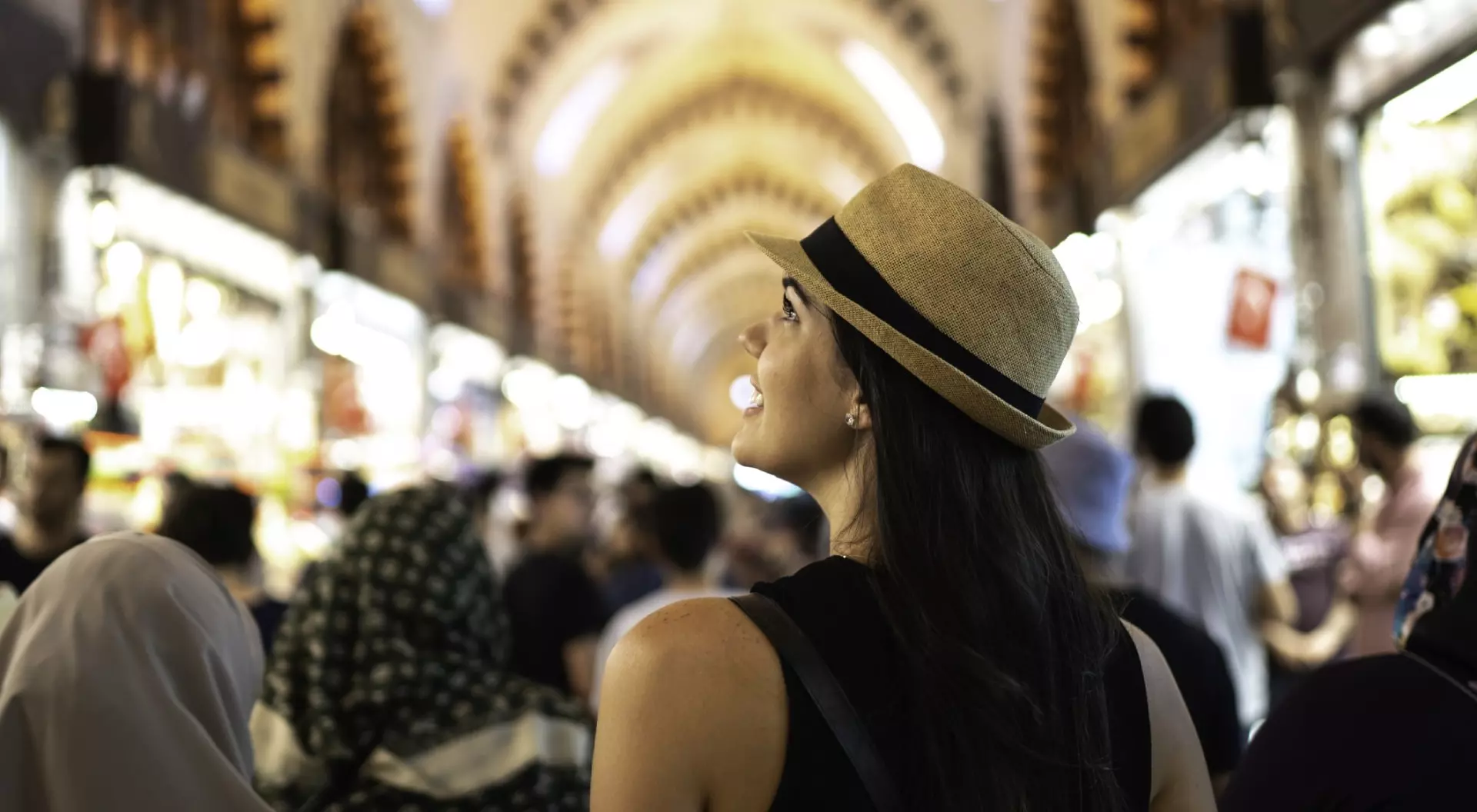 Rear view of a woman in awe at a grand bazaar, Istambul, Turkey