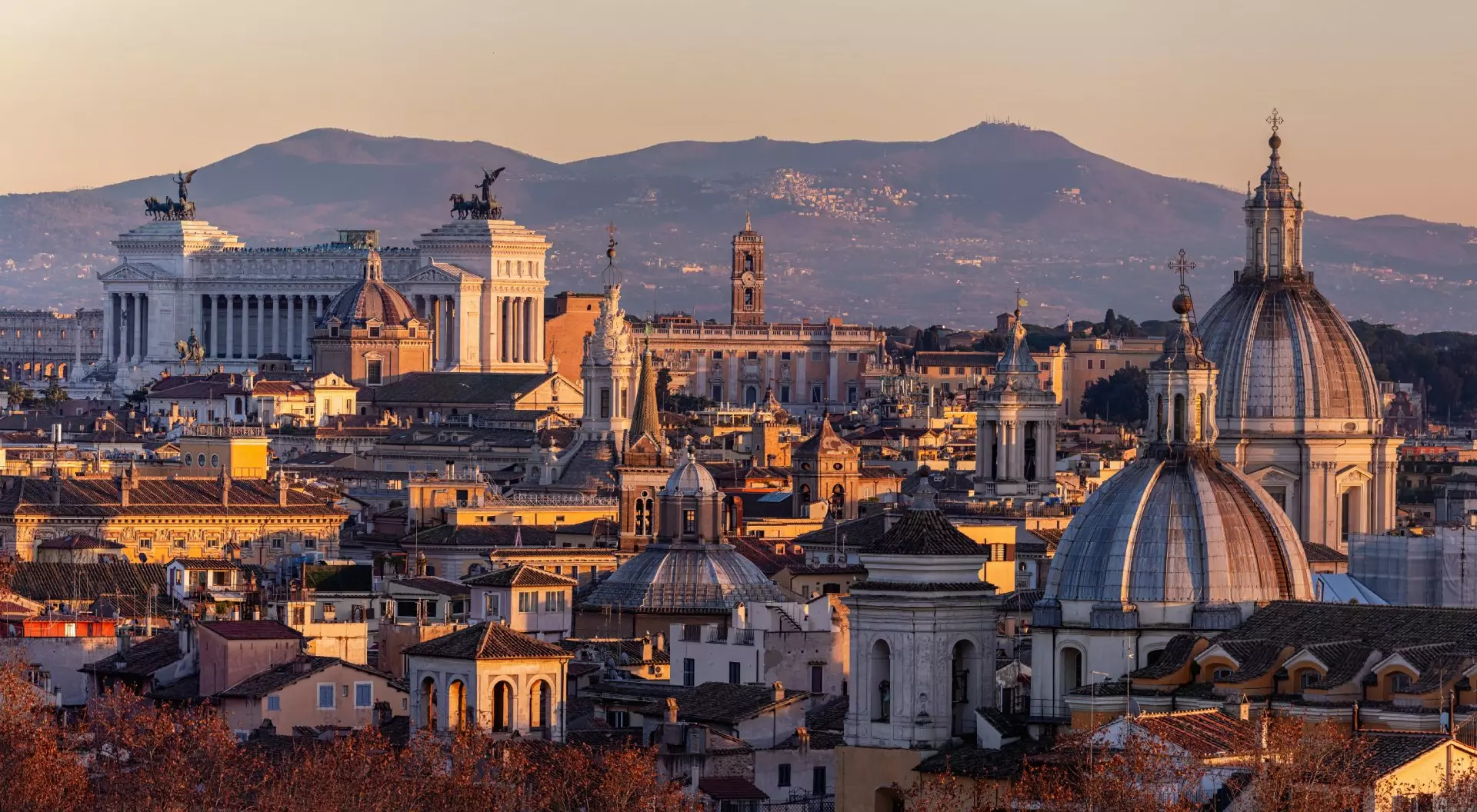 Roof top view of Rome historical center at golden hour. City skyline as seen from Castel Sant'Angelo. Rome, Italy