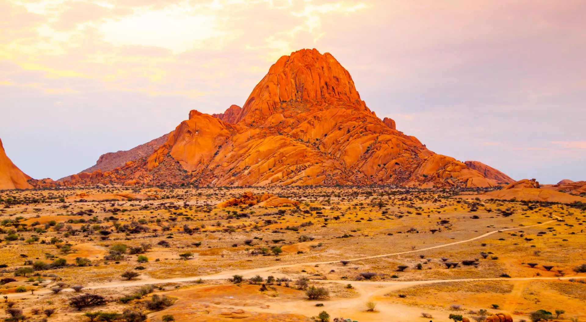 Spitzkoppe, aka Sptizkop - unique rock formation of pink granite in Damaraland landscape, Namibia, Africa.