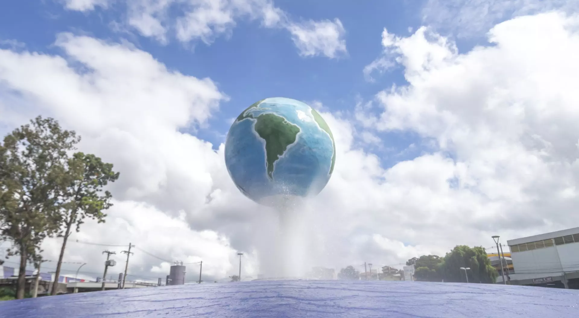Structure of the city presenting the planet earth with blue sky with clouds in the background