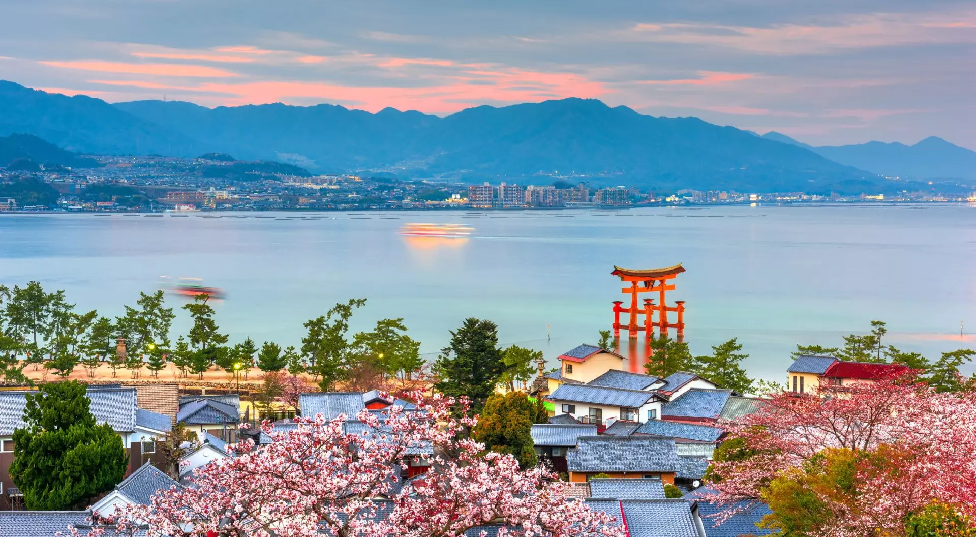 Temples on the Seto Inland Sea at dusk in the spring season, Miyajima Island, Hiroshima, Japan