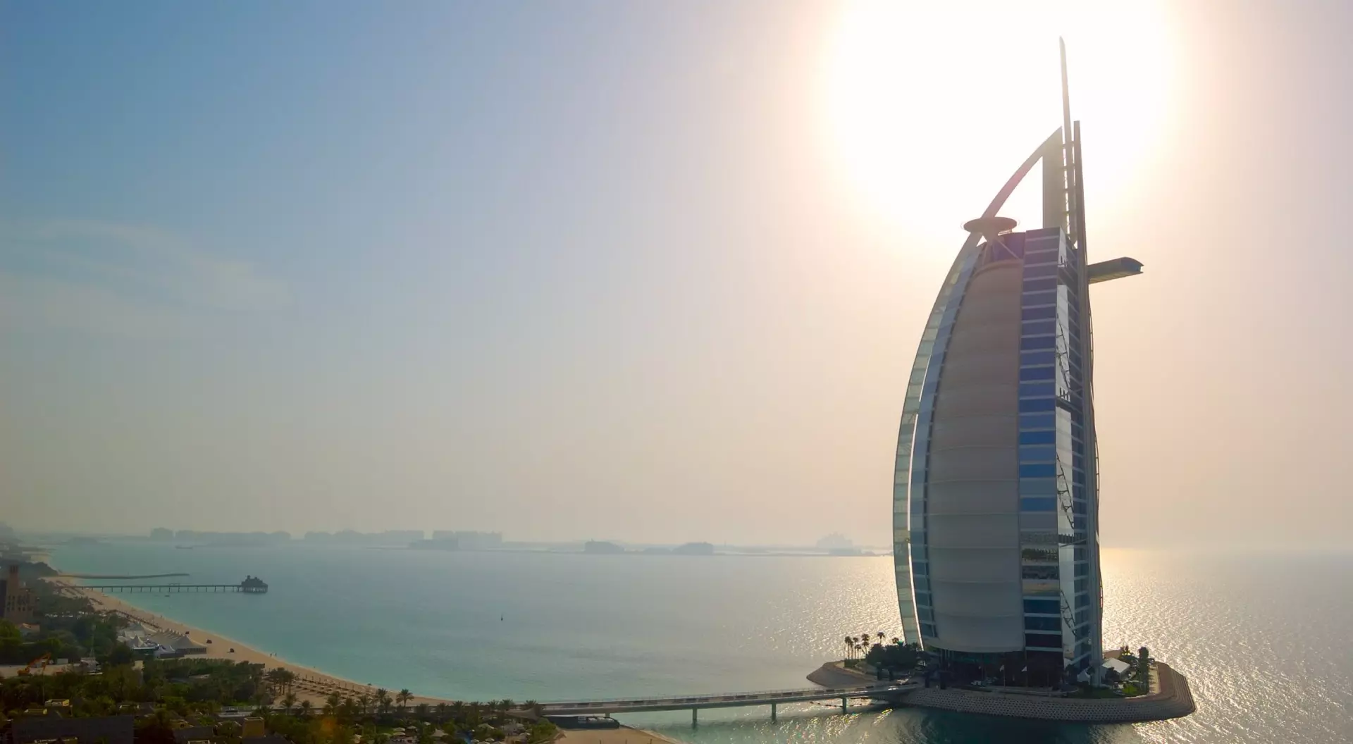 The worlds first seven stars luxury hotel Burj Al Arab - Tower of the Arabs, also known as Arab Sail at sunset