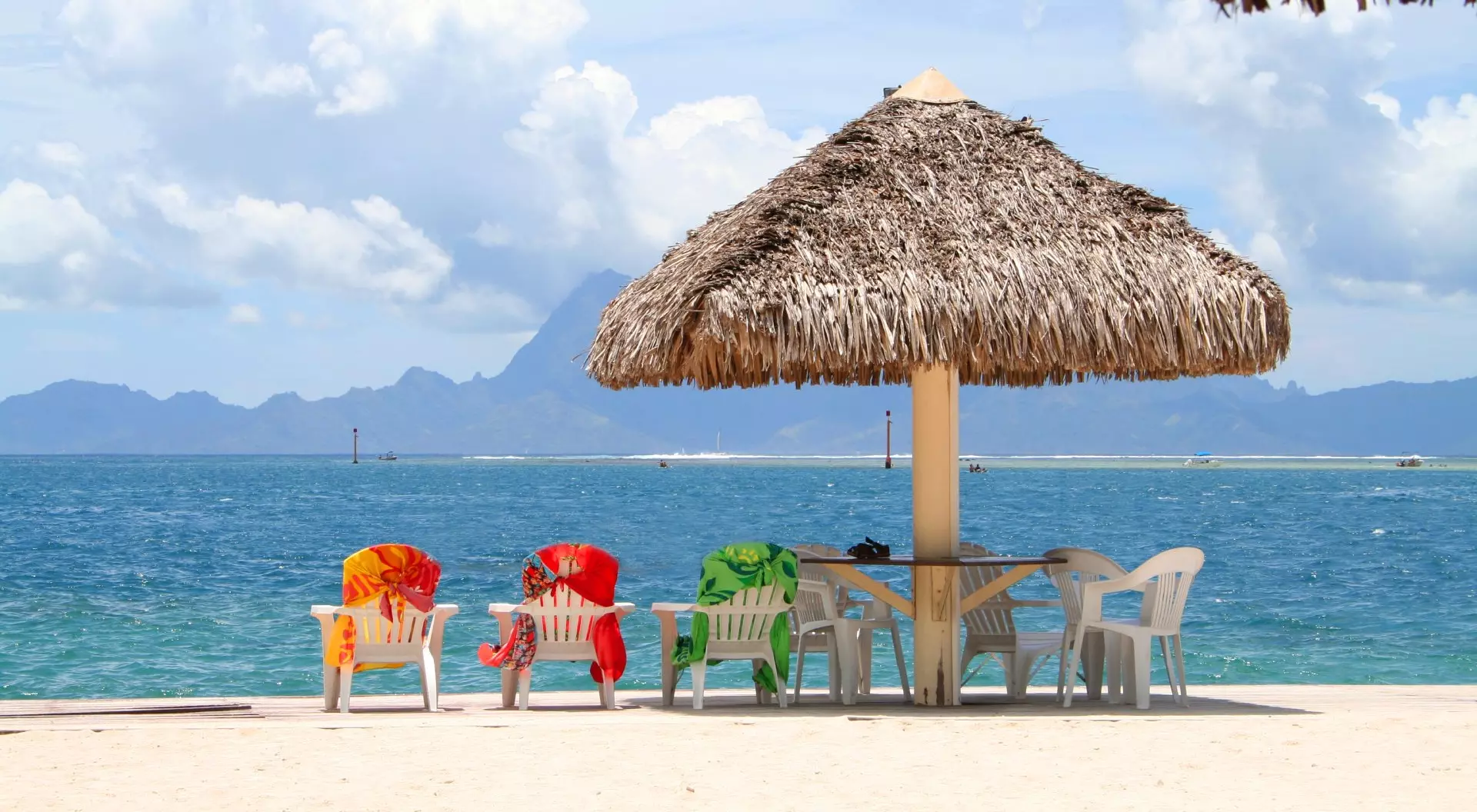 Tahiti, French Polynesia Three Colorful Chairs Aligned on a Beach in Papeete, Tahiti, French Polynesia