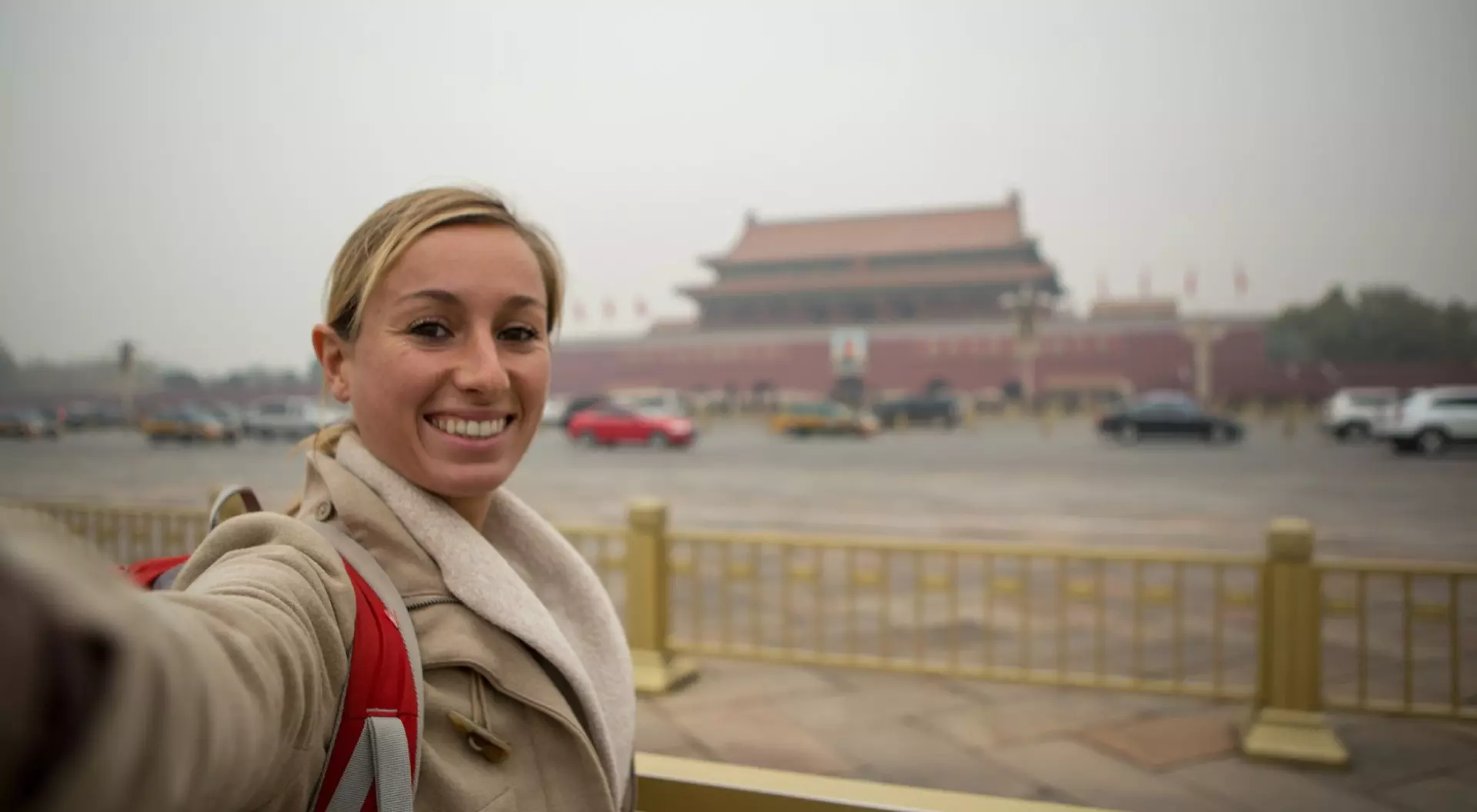Beijing, China Young woman takes selfie in the Forbidden city, Beijing, China