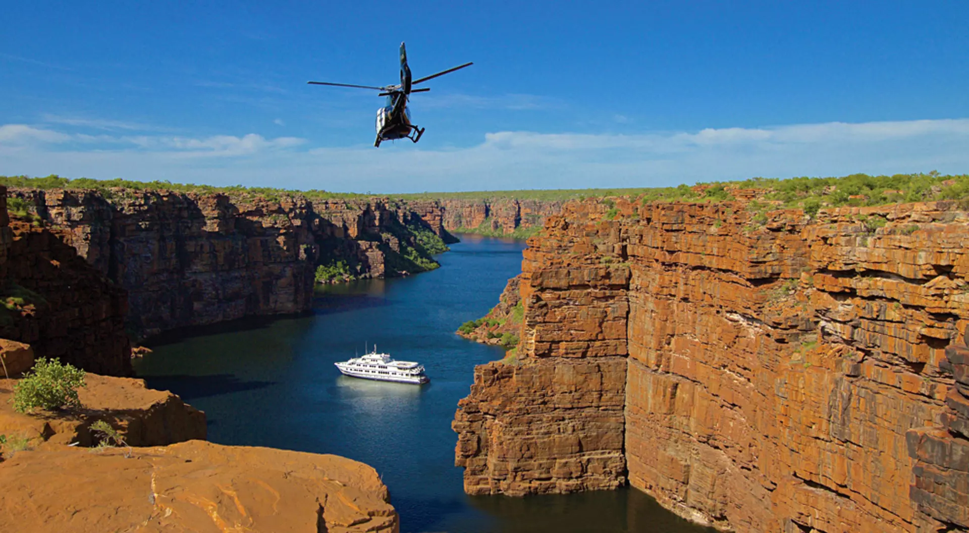 True North Adventure Cruise - Helicopter inbound over King George River, Kimberley, Western Australia, Australia