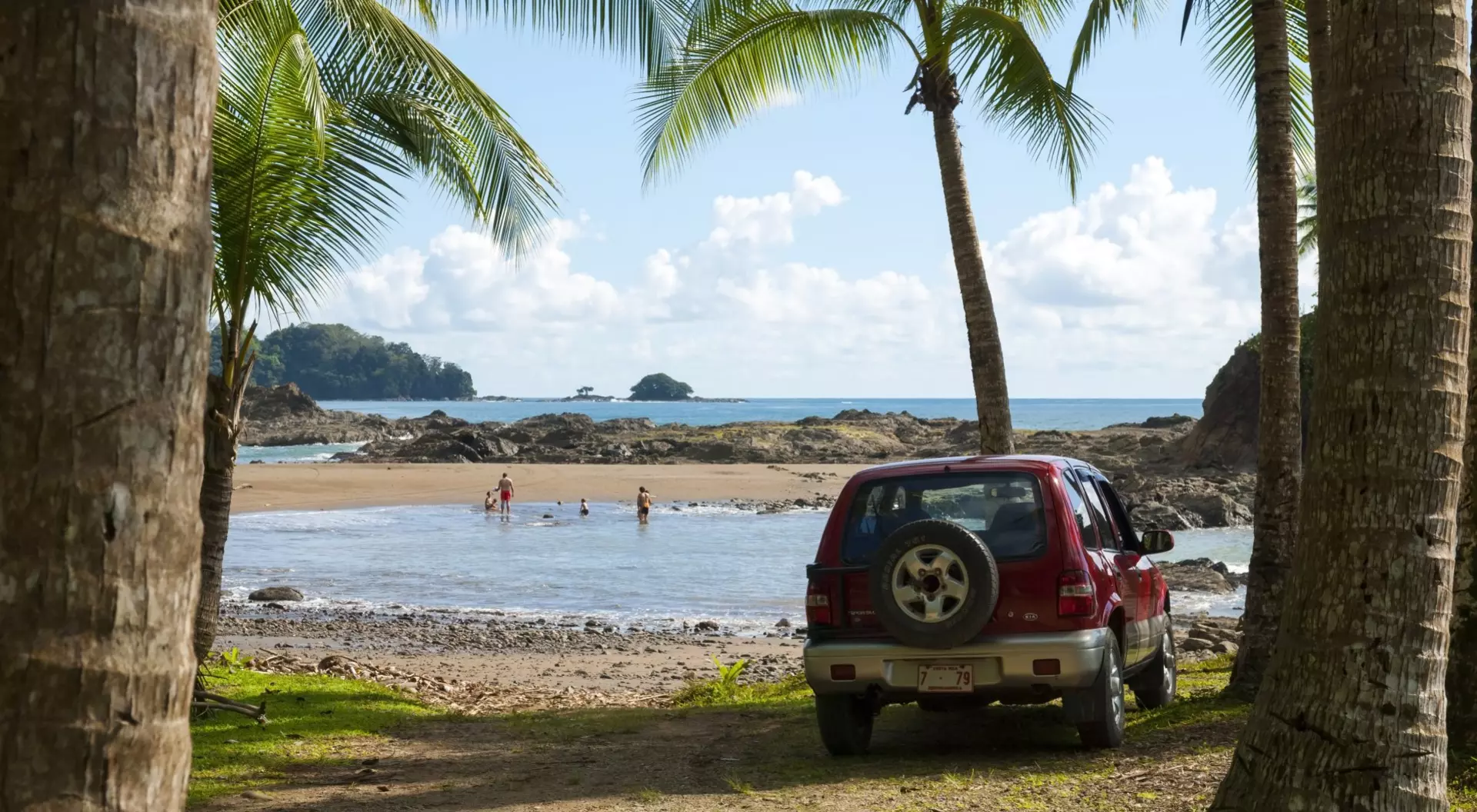 Costa Rica Vehicle and family at the tropical beach