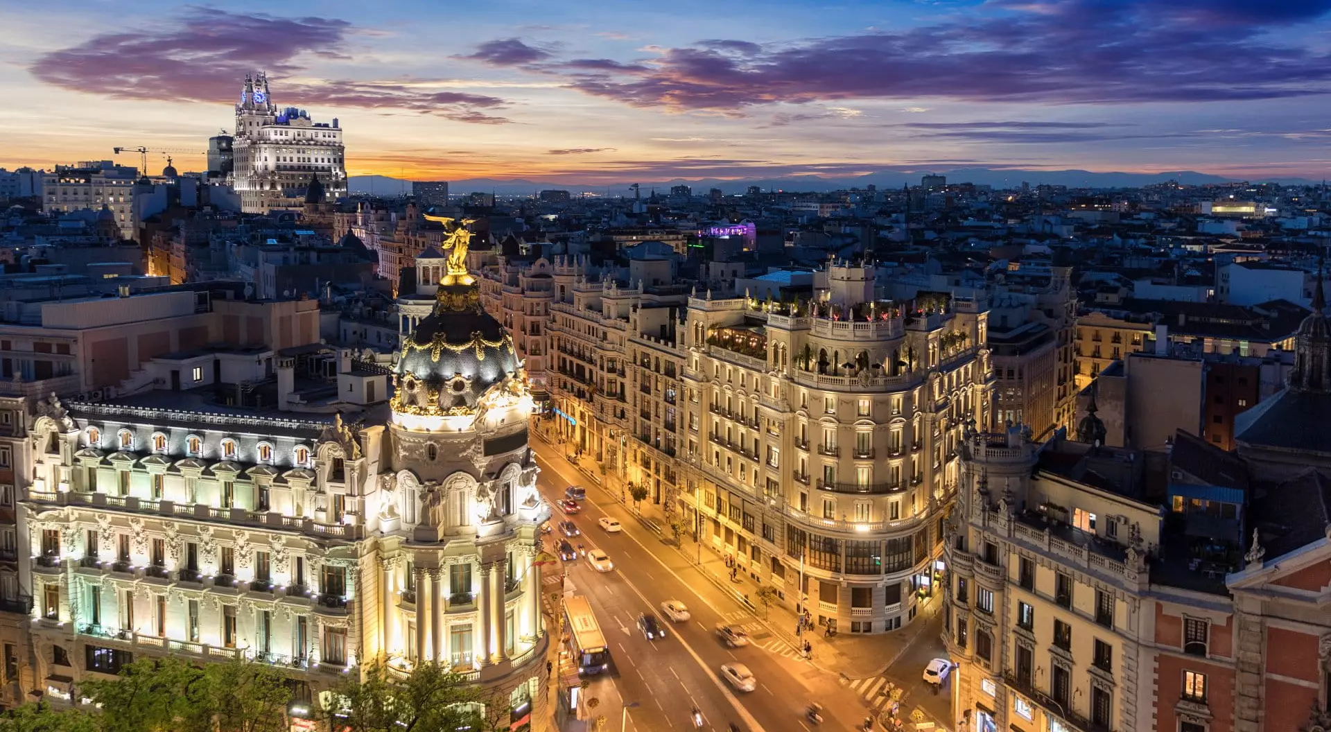 Madrid, Spain View of the Metropolis Building and Gran Via from Circulo de Bellas Artes rooftop at sunset, Madrid, Spain