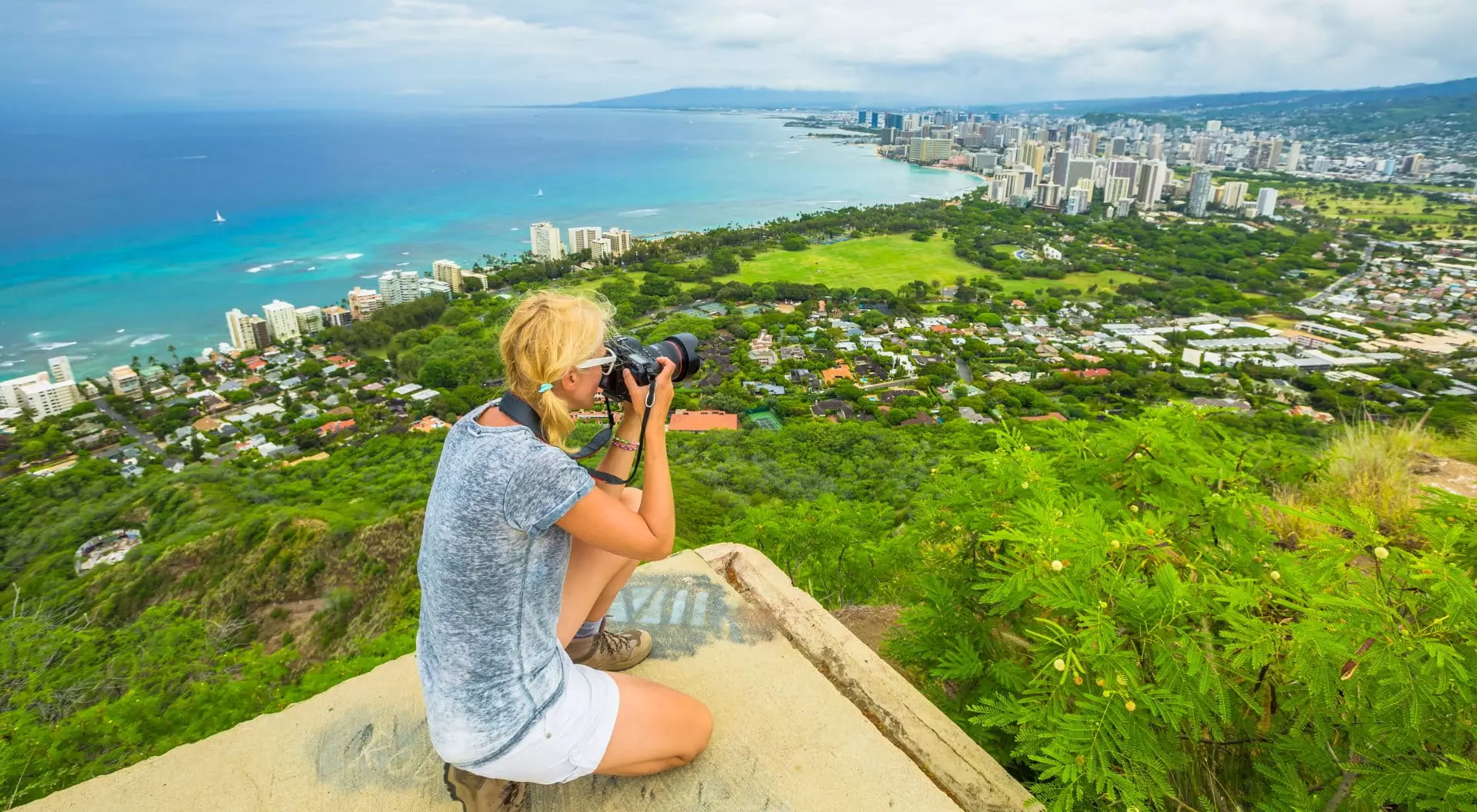 Hawaii Woman Photographing Honolulu and Waikiki Beach from Diamond Head State Monument, Oahu, Hawaii, USA