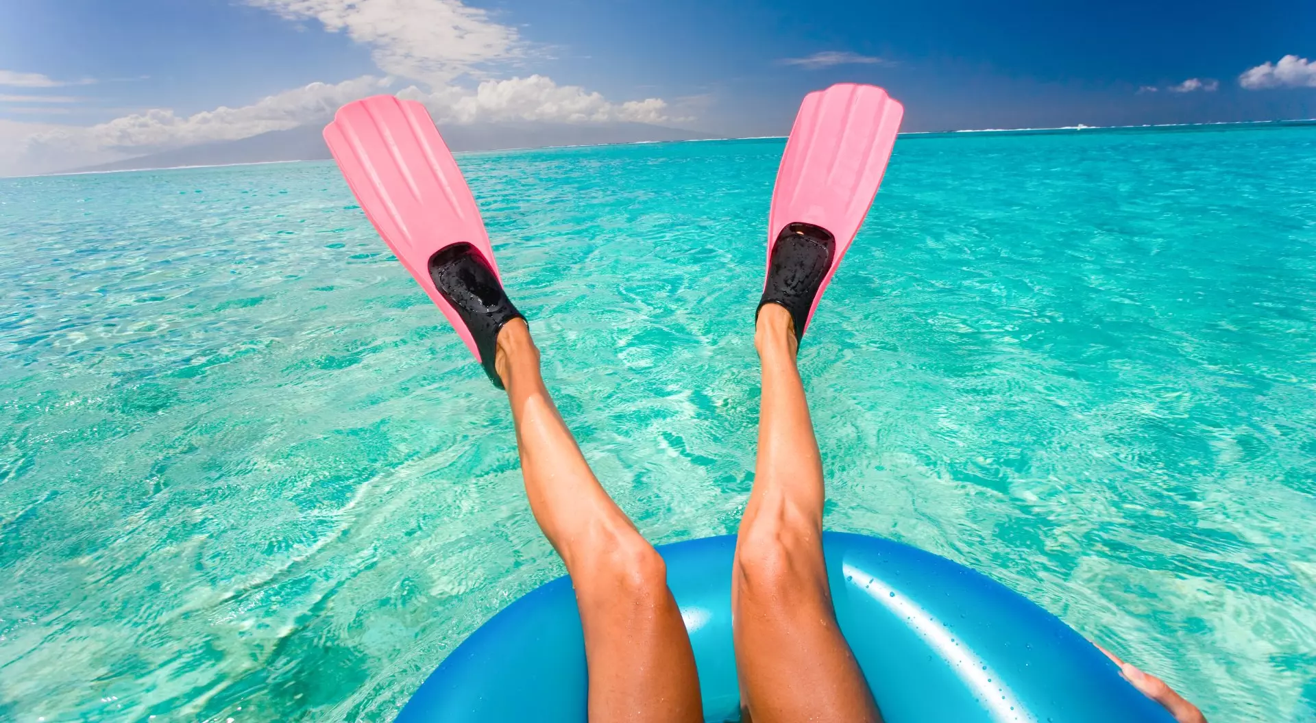 Tahiti Woman with Pink Fins Floating in Turquoise Waters