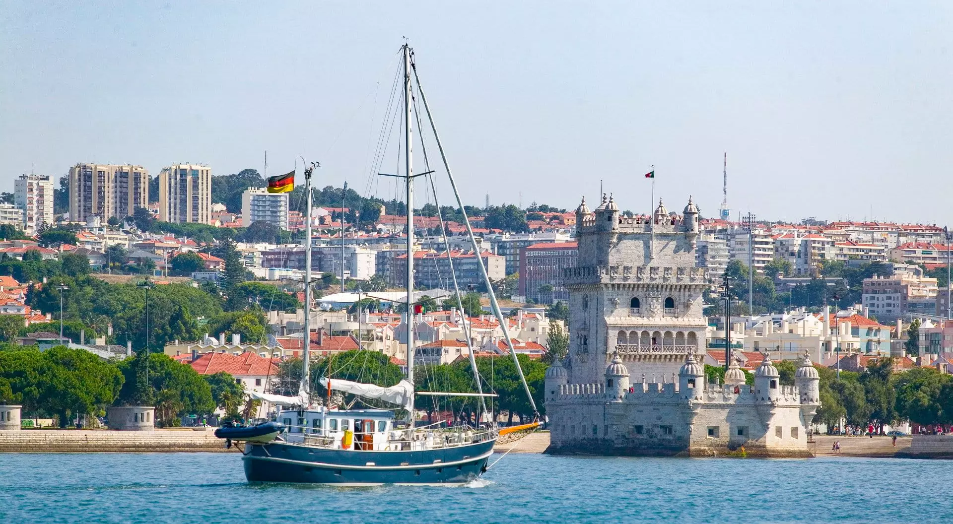 Yacht passing Belem Tower in Belem district, Lisbon, Portugal