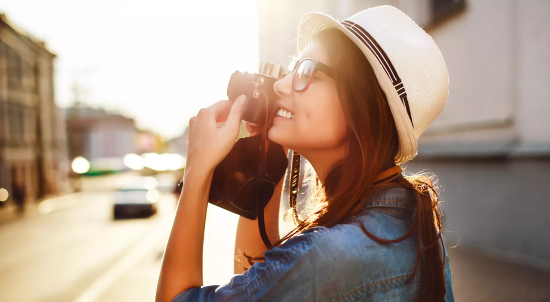 Young Female Tourist in Europe taking Pictures with Camera