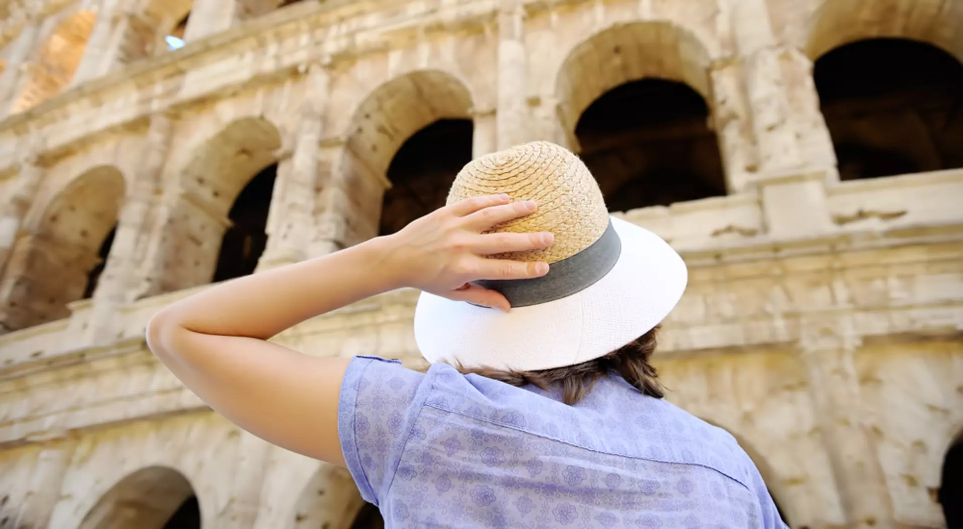 Rome, Italy Young female traveller looking at the Colosseum in Rome, Italy