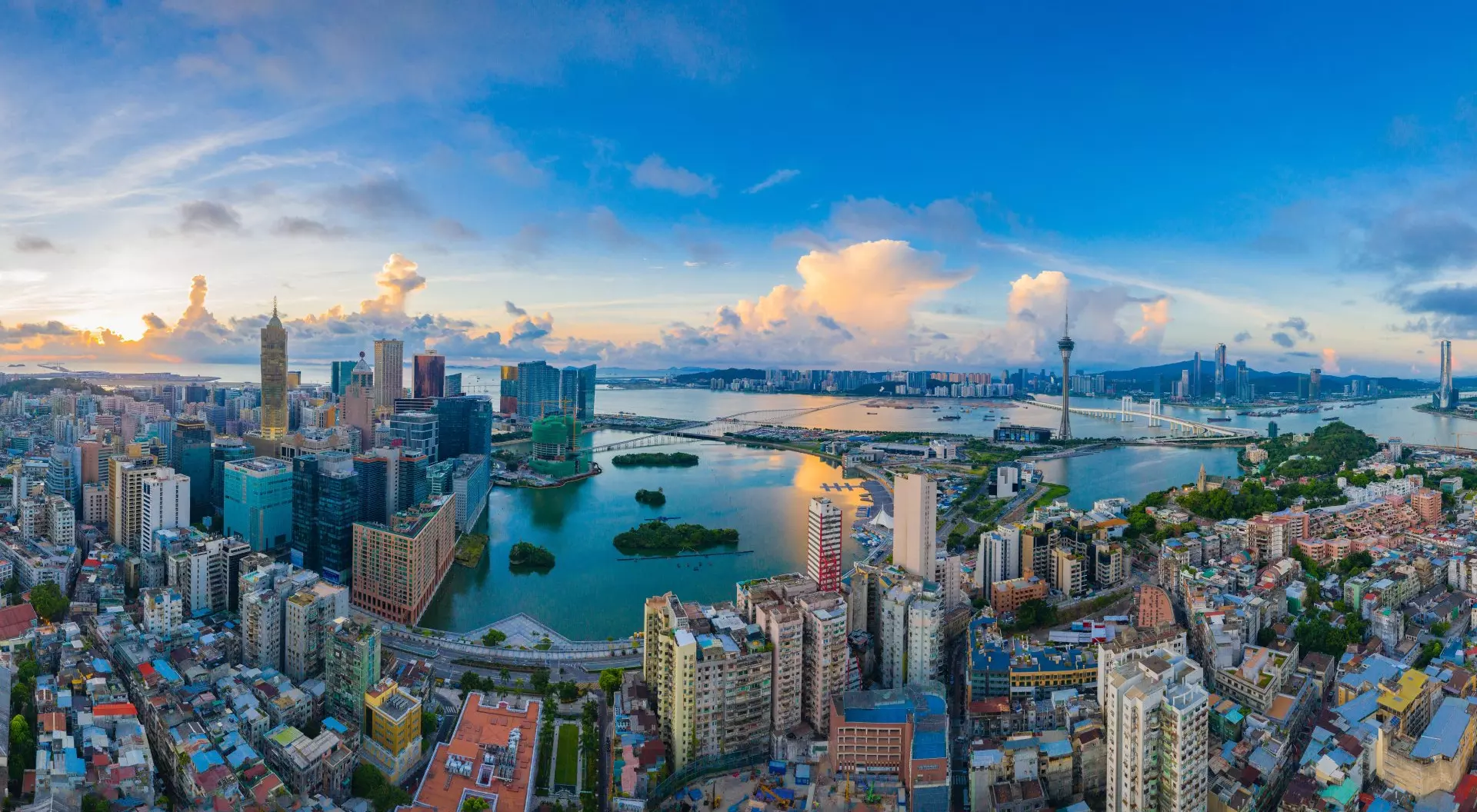 aerial view of a sprawling peninsula city next to the water