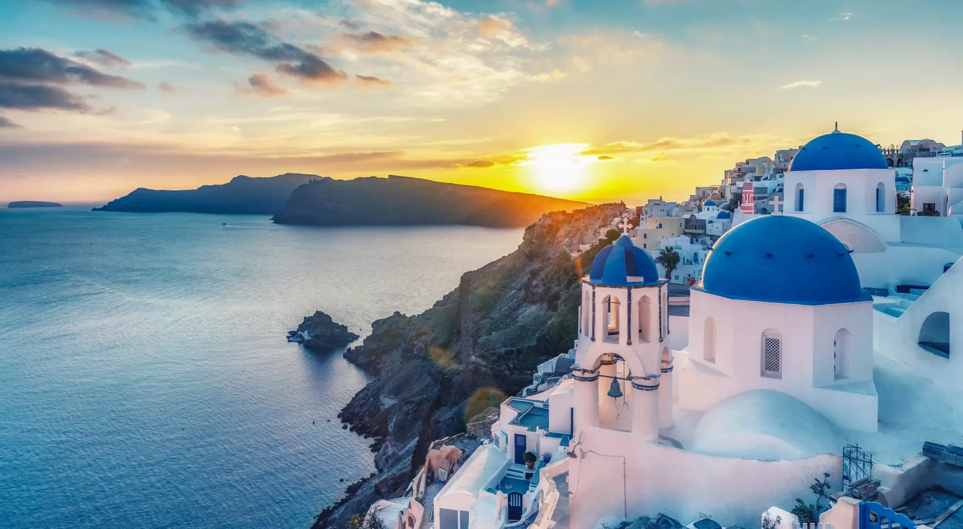 Santorini, Greece Sunset views of the sea from Oia on the Greek Island of Santorini.