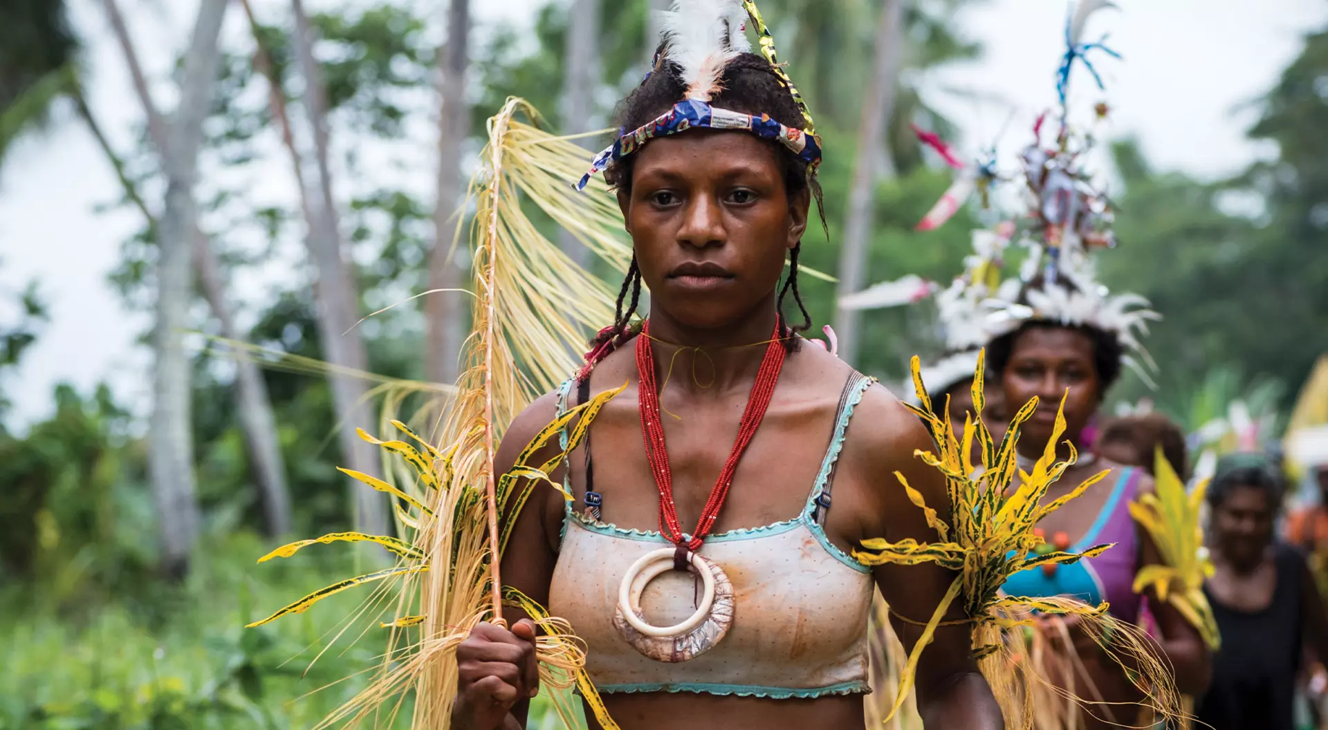 woman in Papua New Guinea dressed in traditional outfit