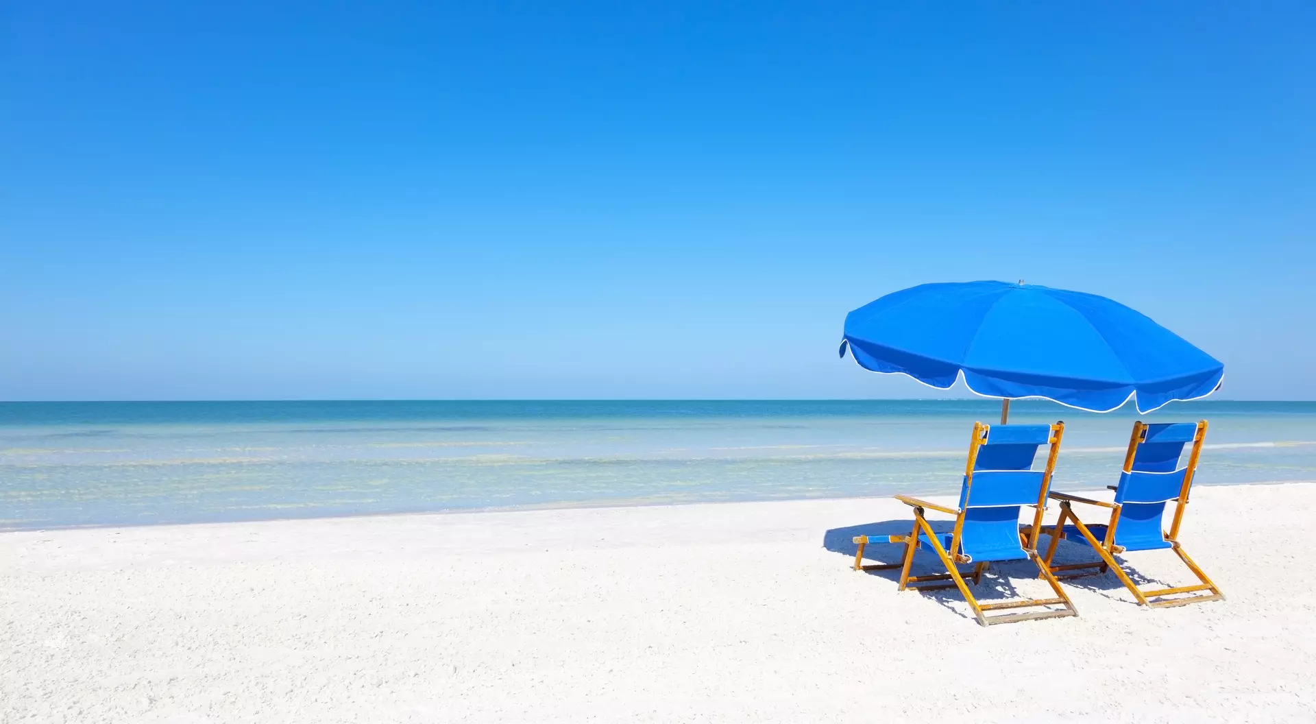 Lounge Chairs and Umbrella at the Beach