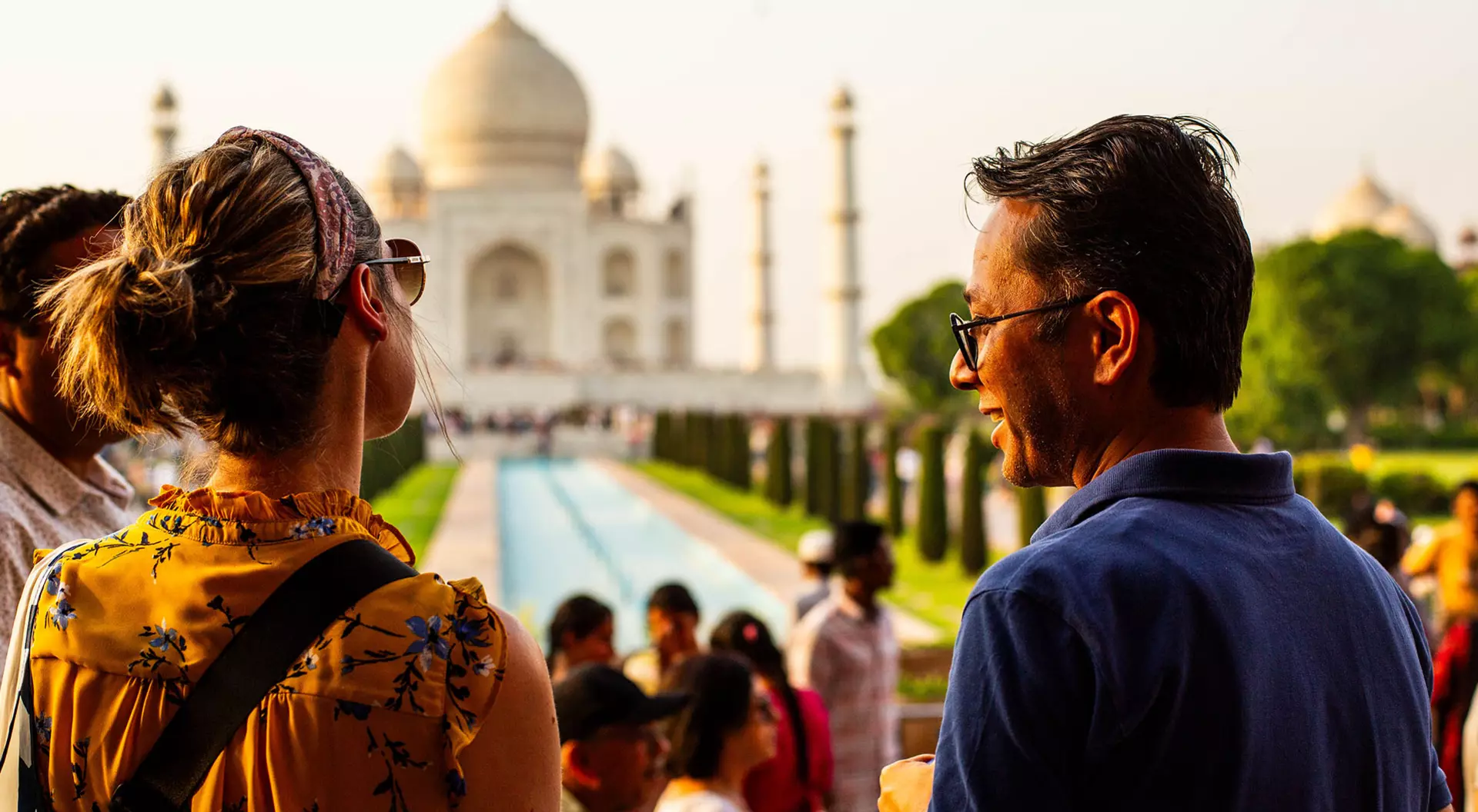 A group of travellers in front of the Taj Mahal in Agra, India