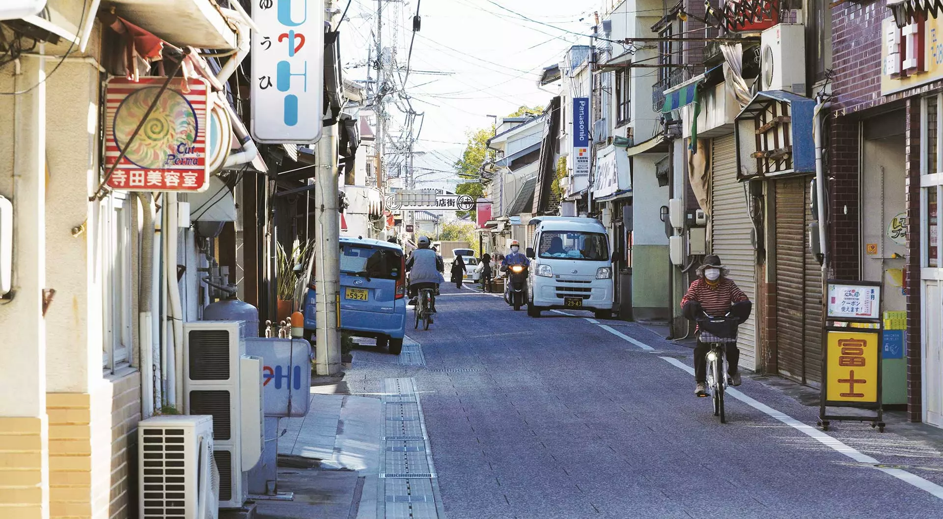 Setoda, Japan view of street in Japan with cars and shops on either side