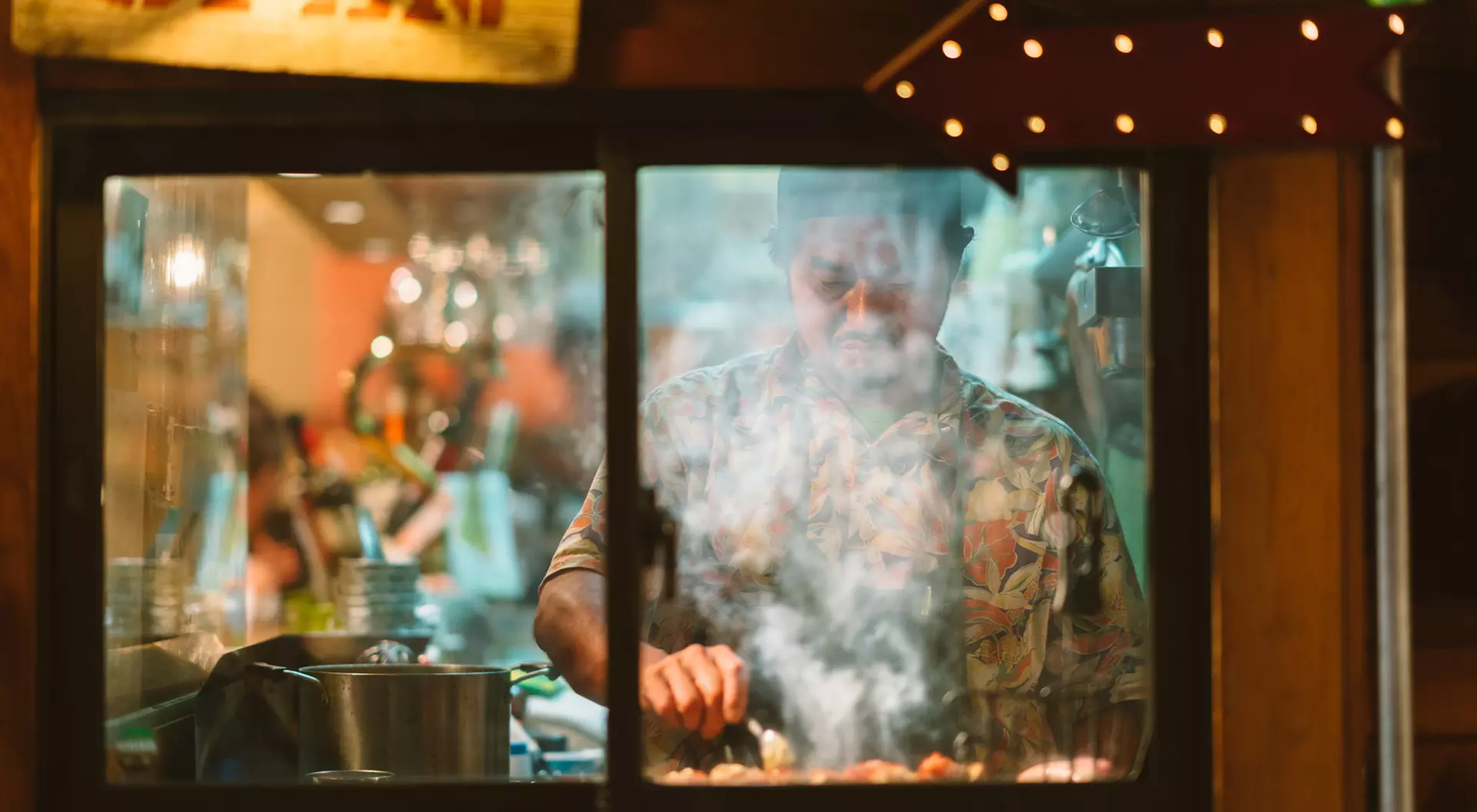 A chef smokes some yakitori in a restaurant in Tokyo, Japan.