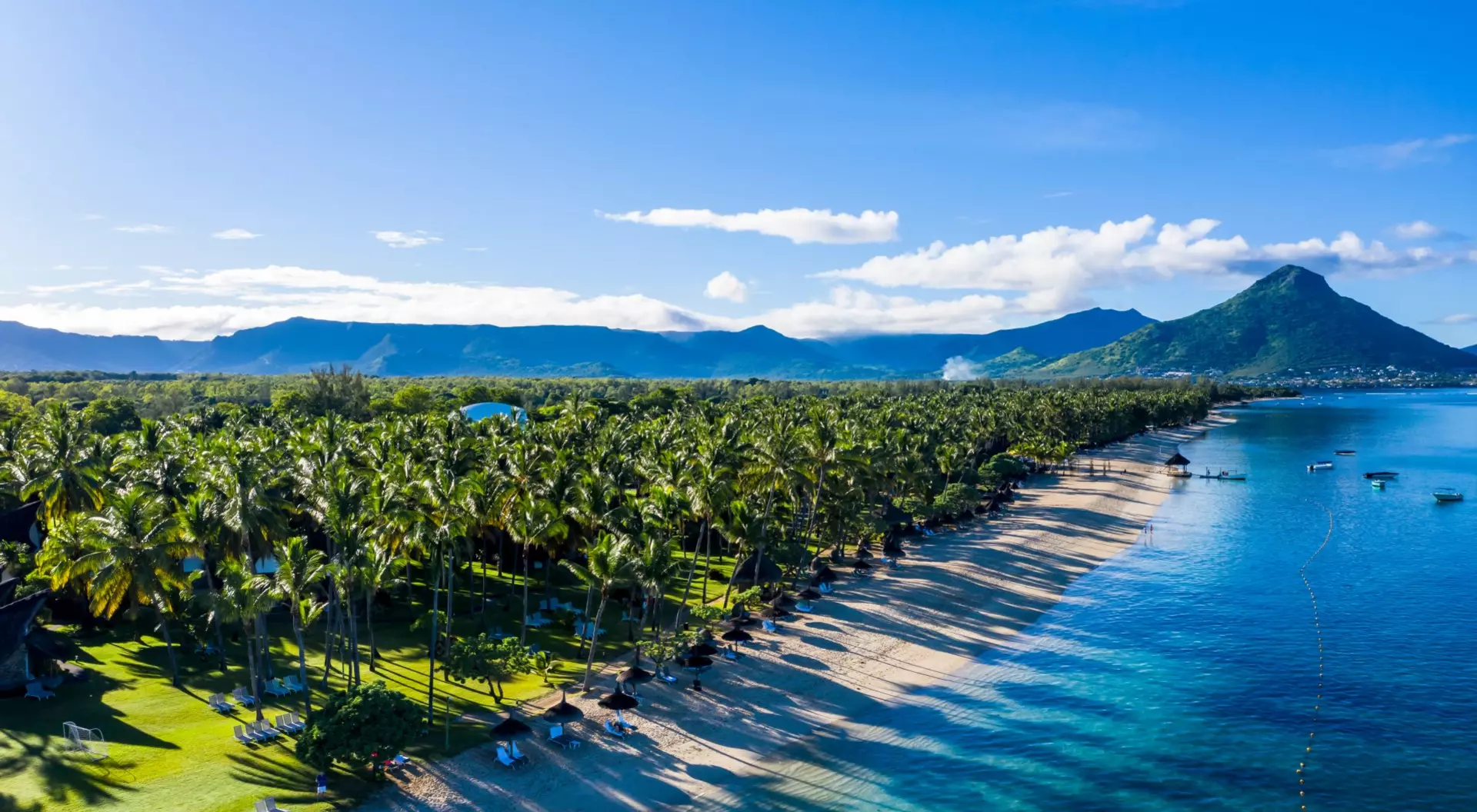 Flic en Flac, Mauritius Aerial view of beach and forest with mountain backdrop in Mauritius