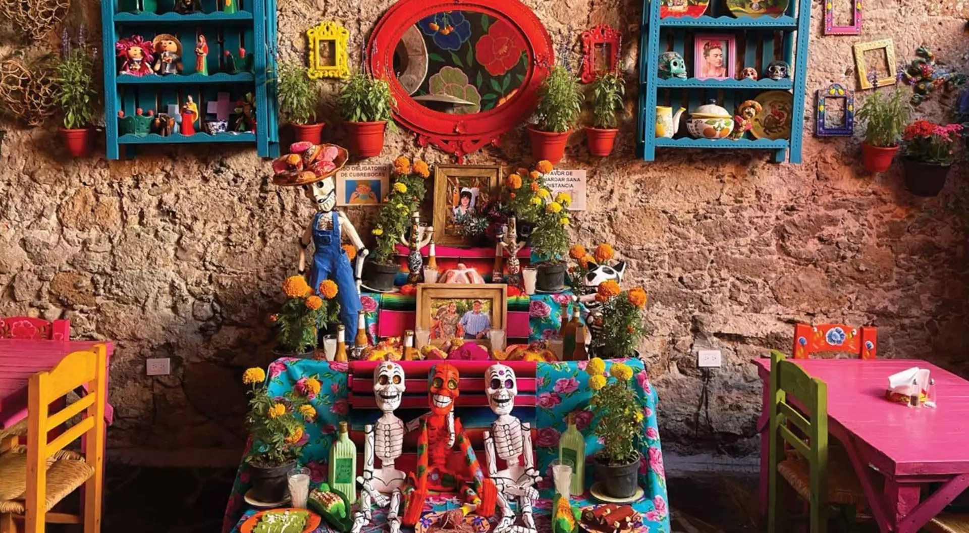 candles and other tokens on a shelf altar