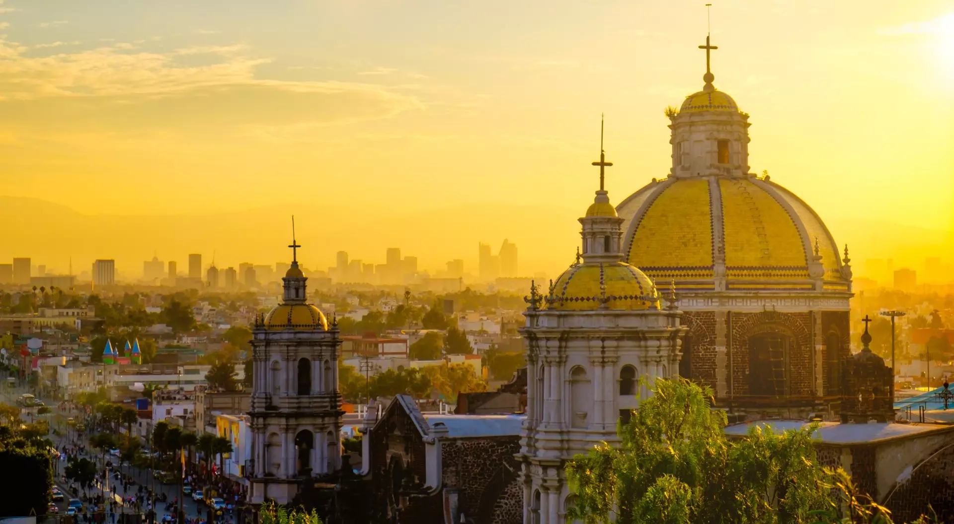 Basilica of Guadalupe, Mexico City, Mexico dome of a basilica overlooking a colonial city at sunrise