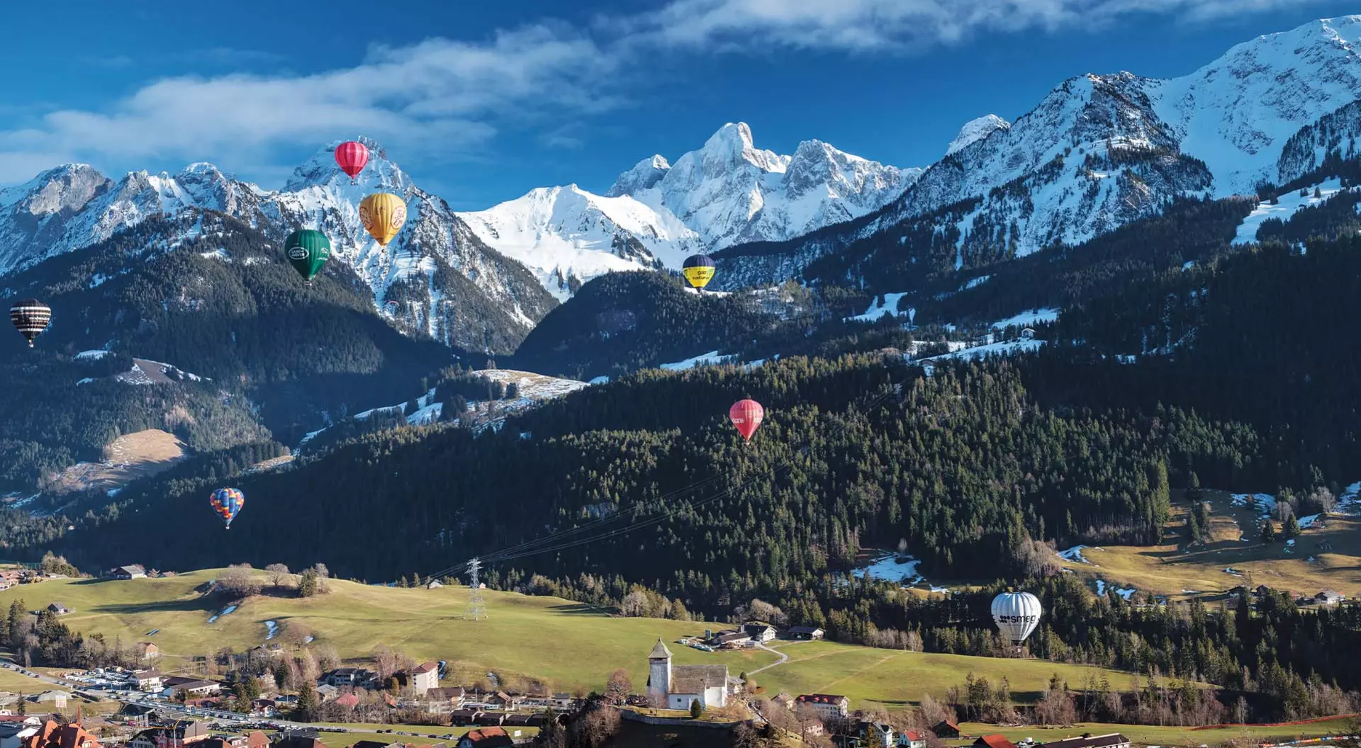 Swiss Alps View of hot air balloons over the Swiss Alps in Switzerland.