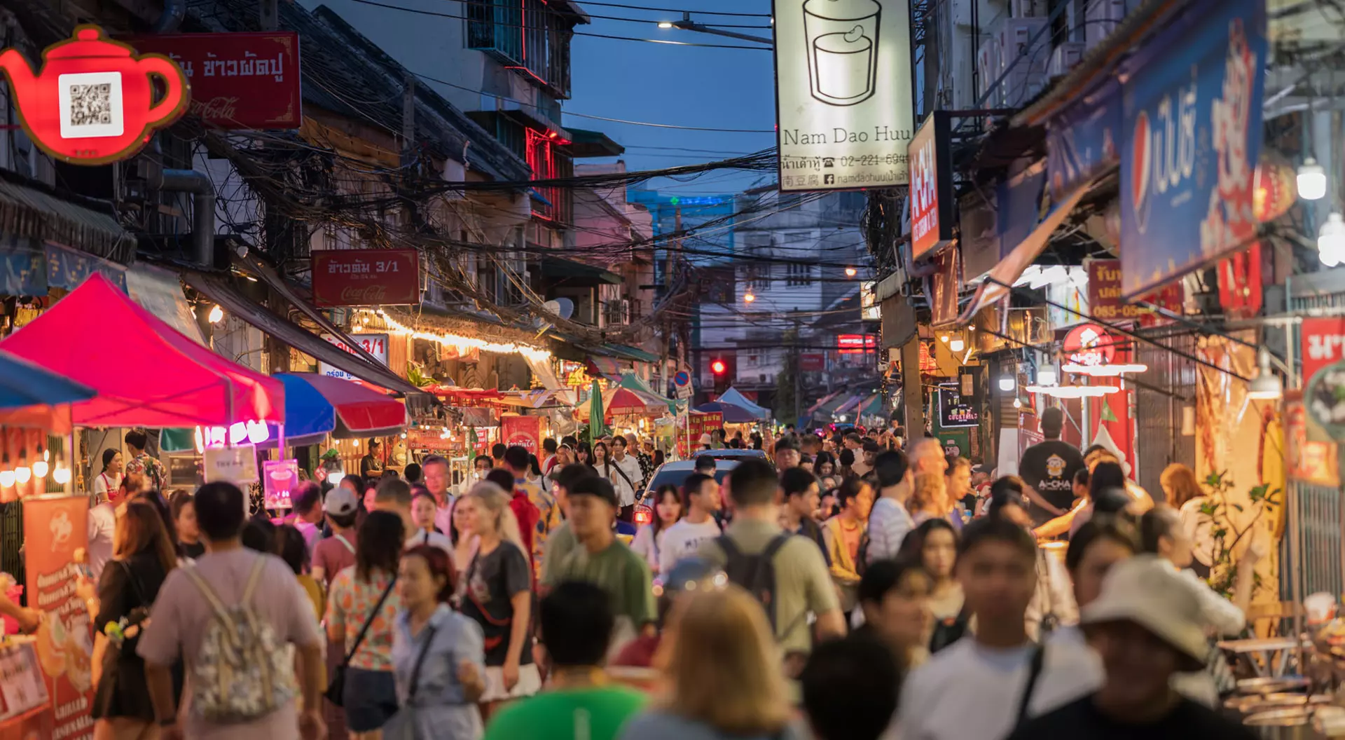 Bangkok, Thailand A crowded scene of people eating street food and shopping in Chinatown in Bangkok, Thailand