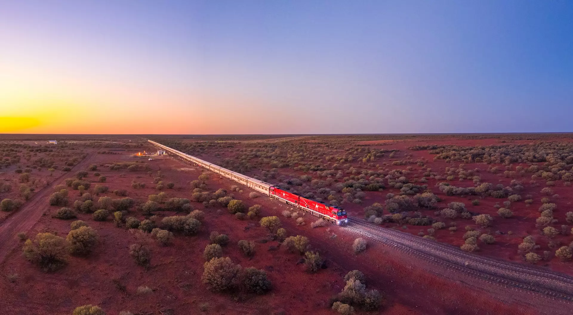 The Ghan, Australia (©Journey Beyond) An aerial shot of a train passing through the Australian outback.