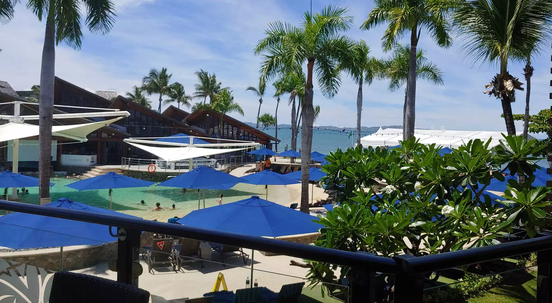 beach cabanas with palm trees