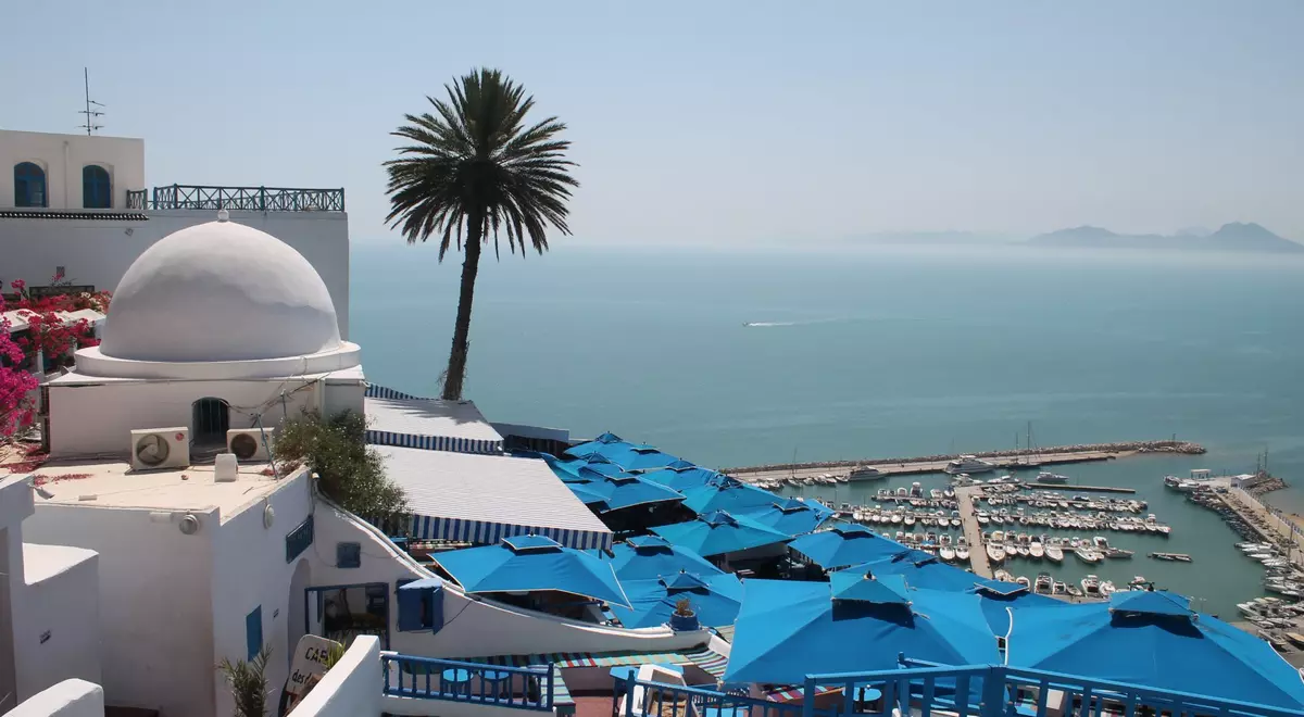 https://images.goway.com/production/styles/article_featured_image_xl/s3/featured_images/Sidi-Bou-Said-overlooking-the-Mediterranean-near-Tunis_AdobeStock_1001105241.jpeg.webp?VersionId=KSC_J7aXFv1S9f7BnuNspnYyavq_U_CM&h=3e615b51&itok=4n_OzKw6