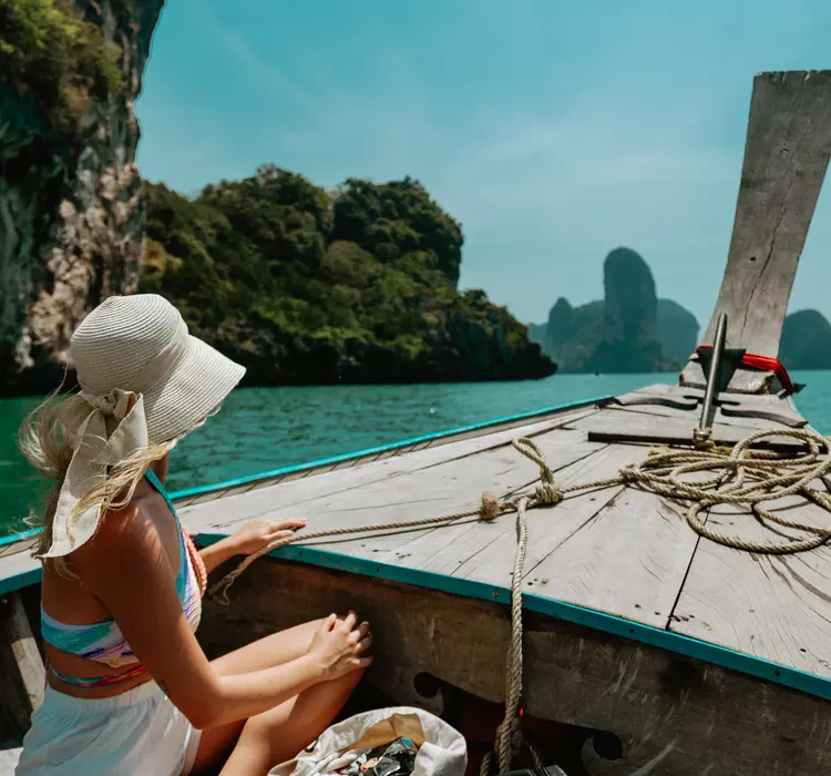 Krabi, Thailand Woman in Thai boat in Krabi, Thailand