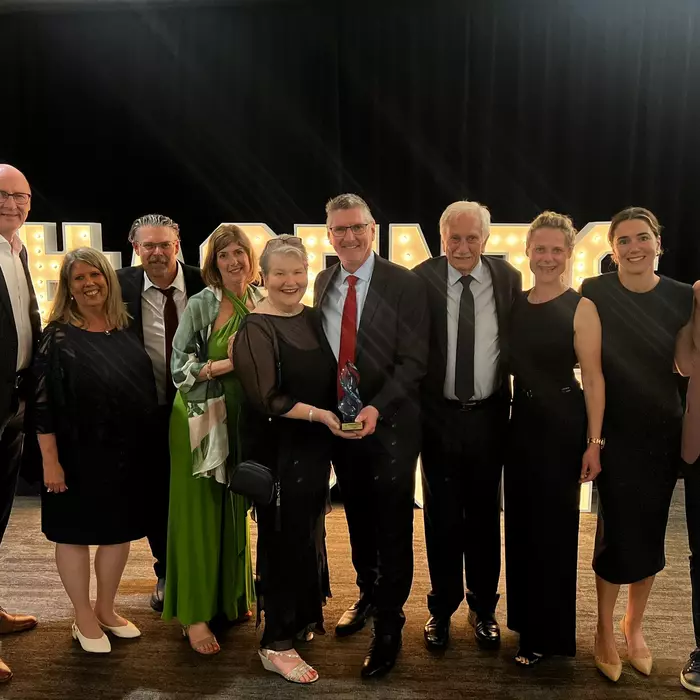 Goway leadership team accepts an award at the Baxters