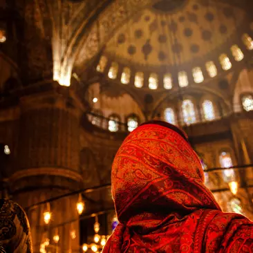 Woman praying inside a mosque in Istanbul, Turkey.