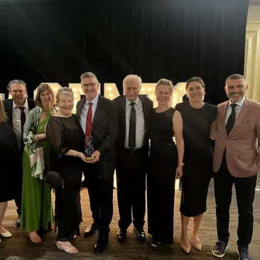 Goway leadership team accepts an award at the Baxters