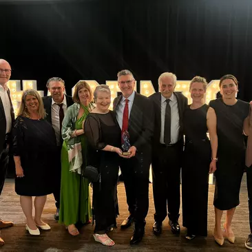 Goway leadership team accepts an award at the Baxters