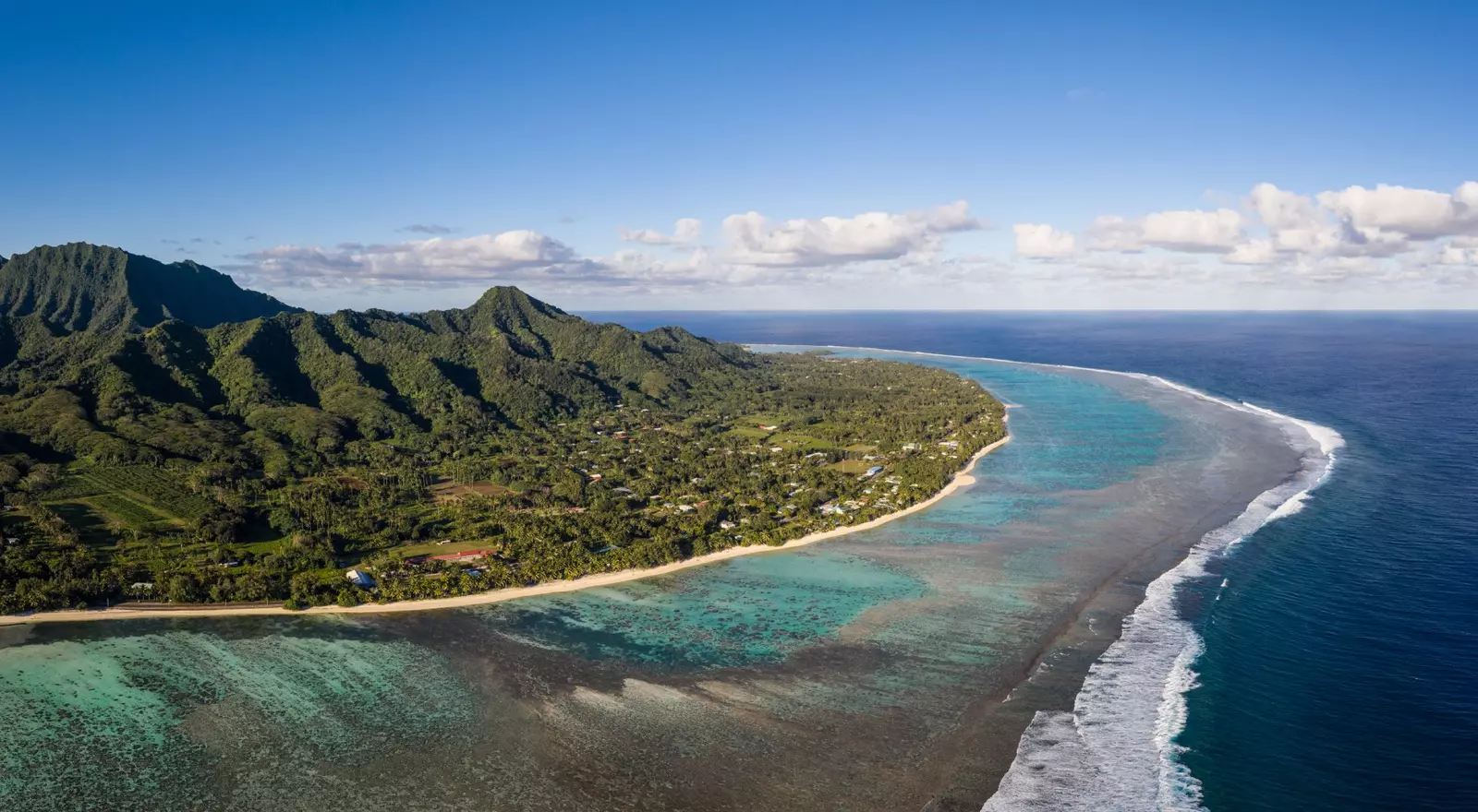 Rarotonga island, part of the Cook islands, in the Pacific ocean, with its jungle covered mountain and stunning beach