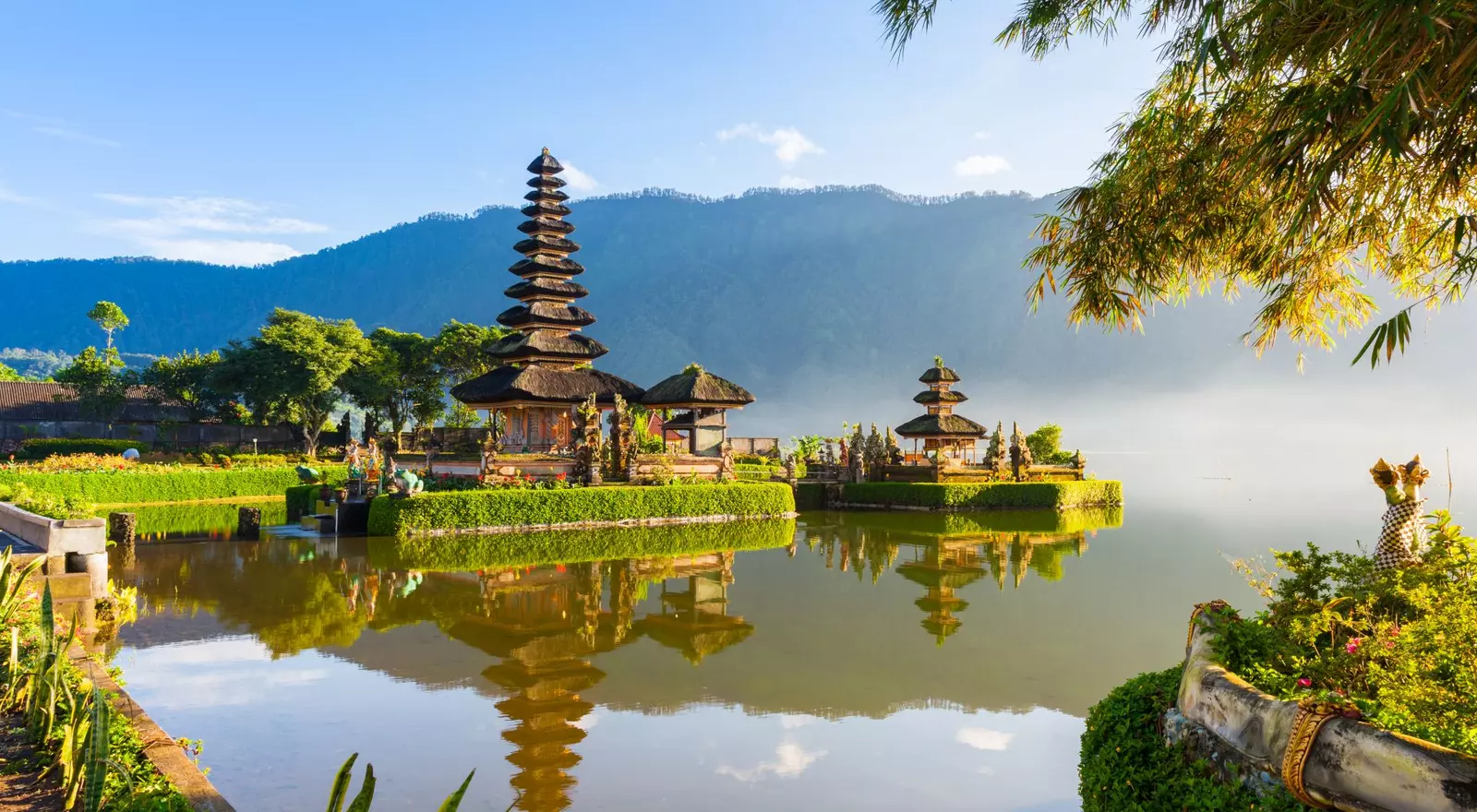 Famous temple with morning mists over the Danau Beratan lake