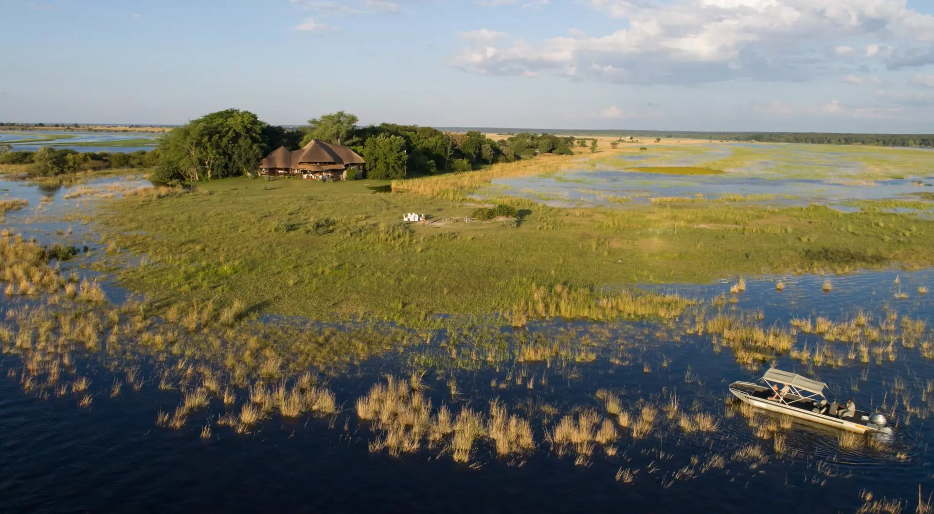 Okavango Delta, Botswana Two mokoro (canoes) pass through the waters of the Okavango Delta in Botswana.