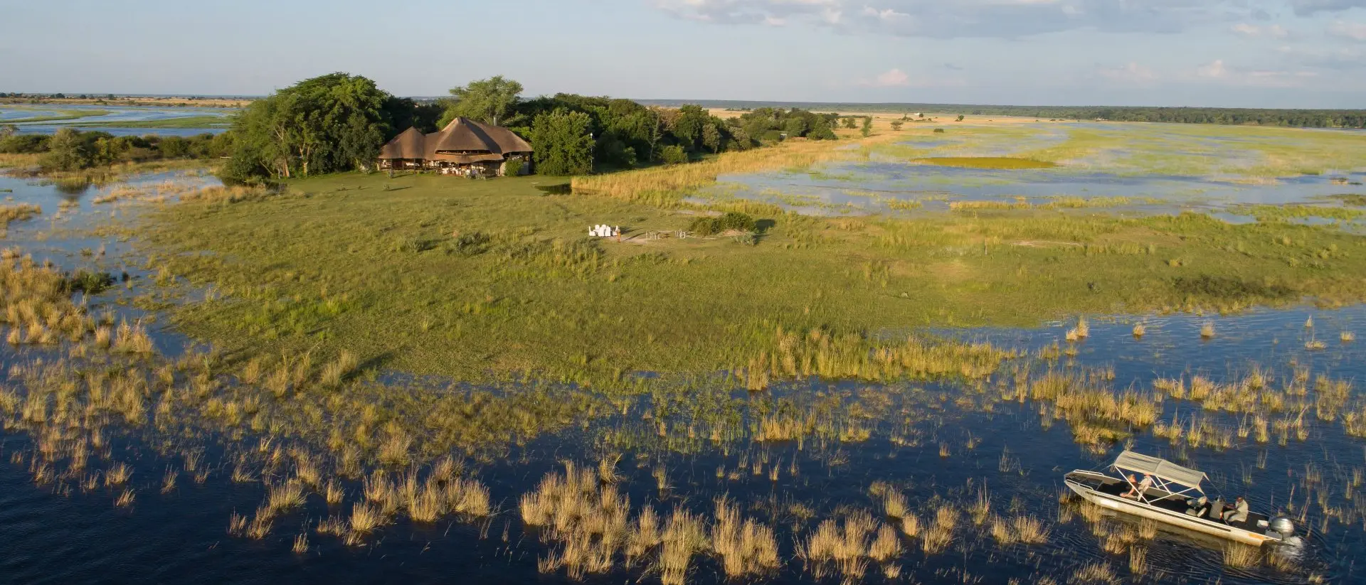 Okavango Delta, Botswana Two mokoro (canoes) pass through the waters of the Okavango Delta in Botswana.