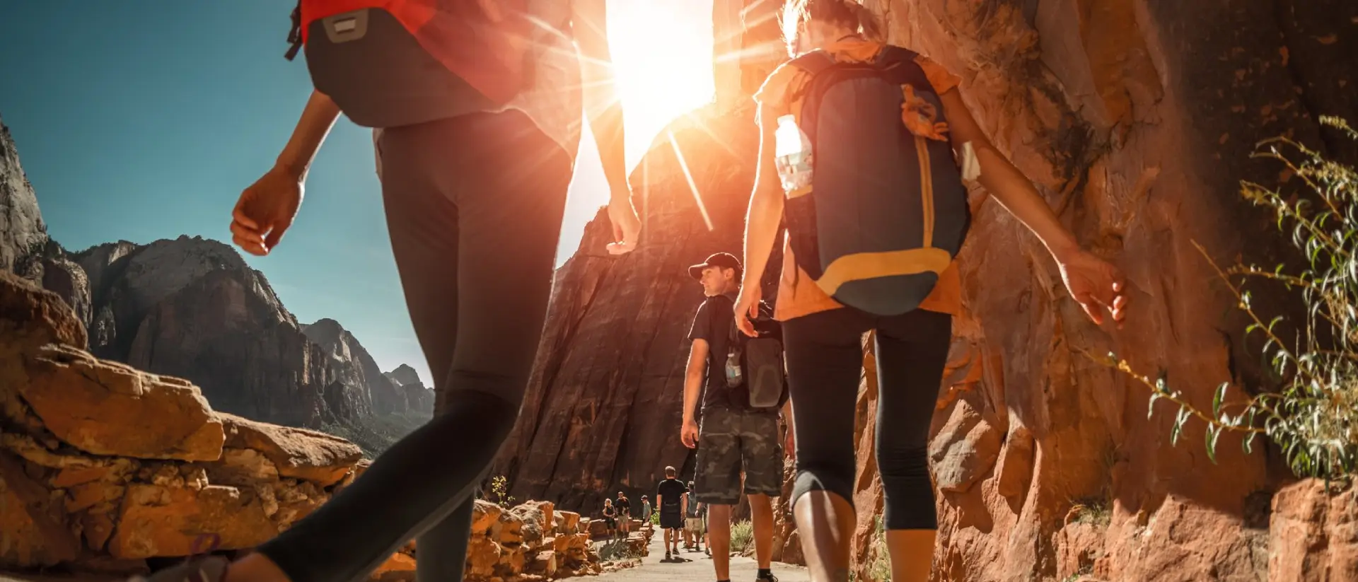 A team hiking through a canyon