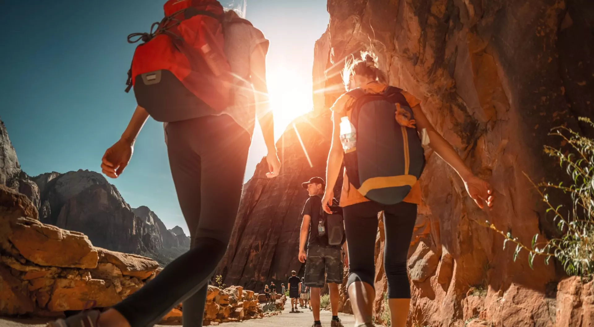 A team hiking through a canyon