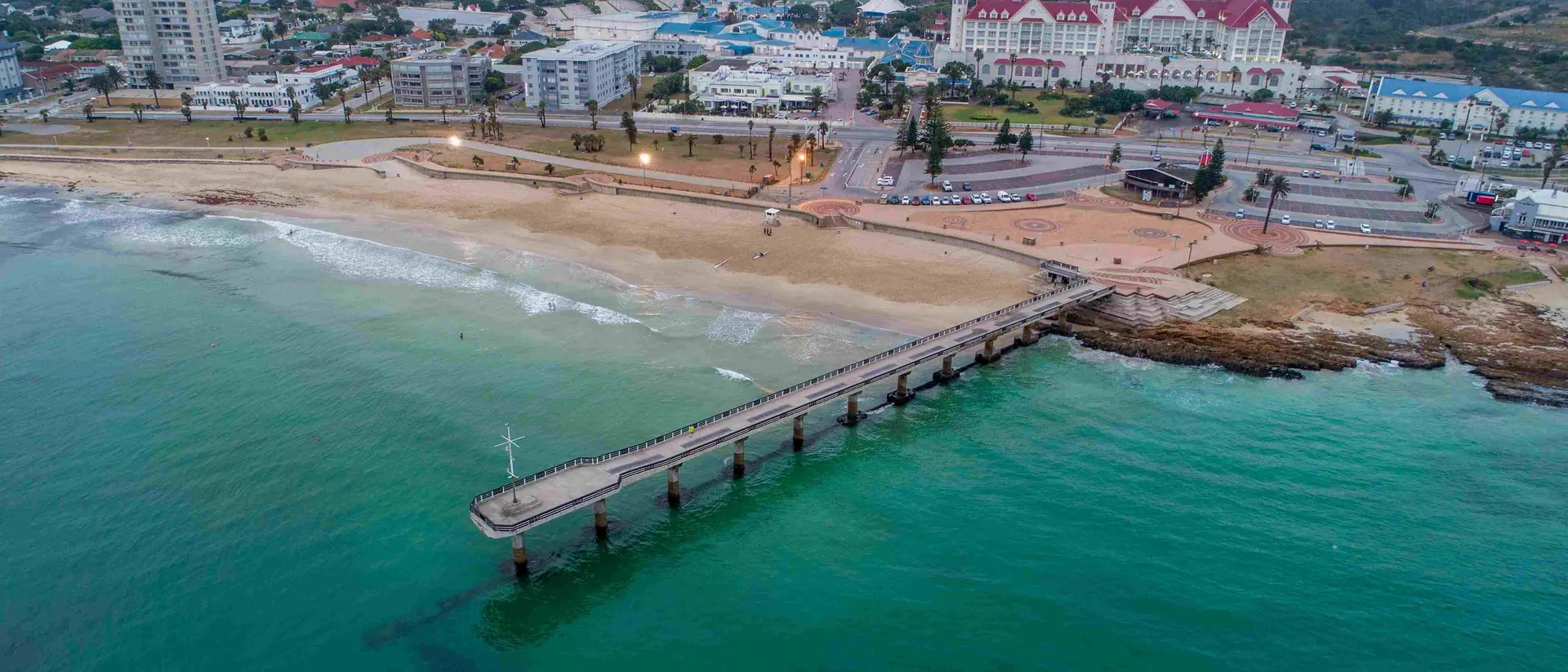 Shark Rock Pier Aerial view of Shark Rock Pier in Port Elizabeth, South Africa. The pier juts out into Algoa Bay, with the city skyline in the background.