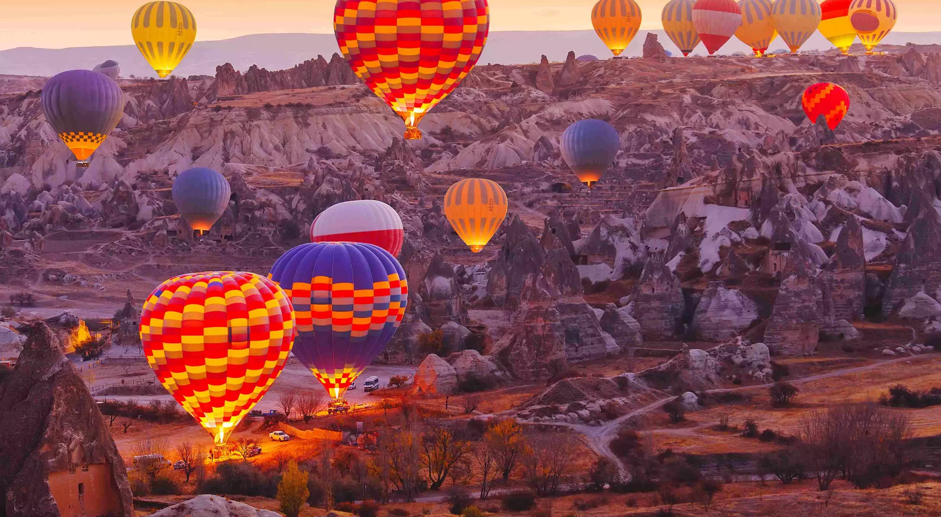 Scenic vibrant view of balloons in flight in Cappadocia Valley