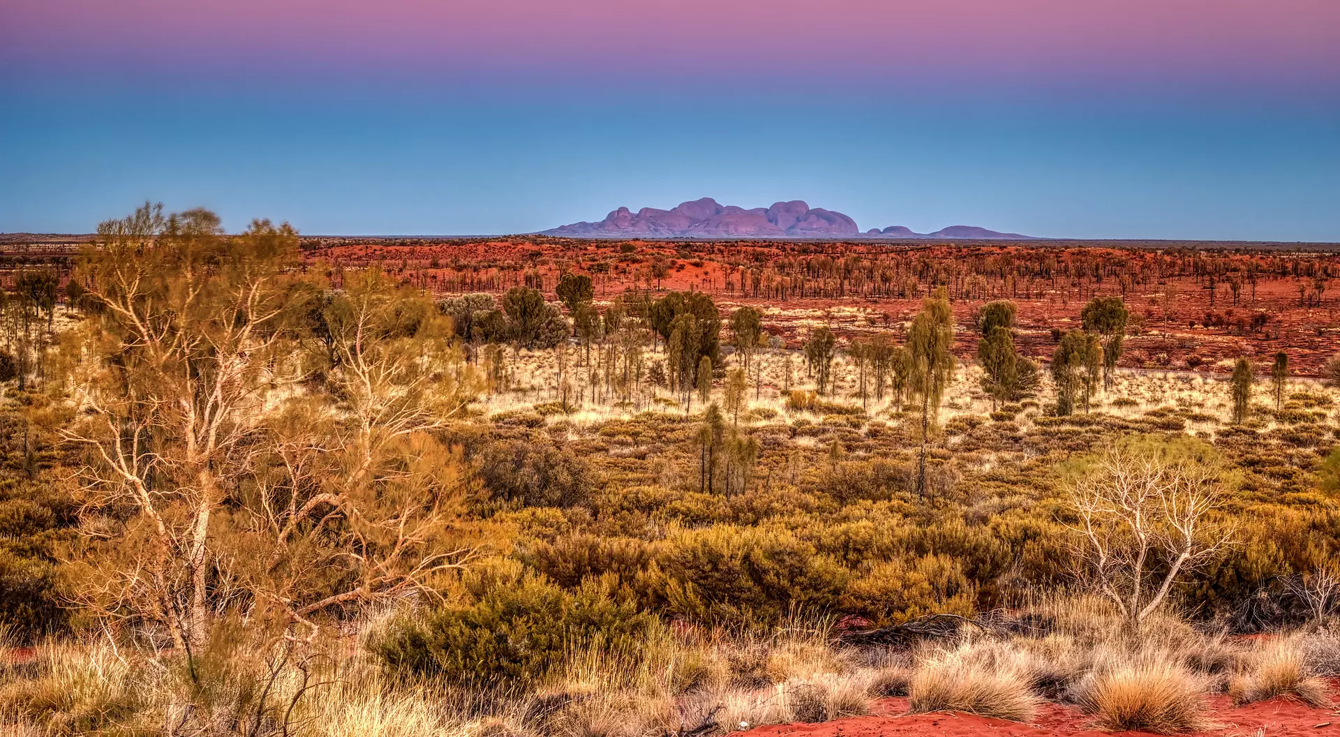 Kata Tjuta Kata Tjuta (the Olgas), soaring rock domes, which glow at sunrise and sunset