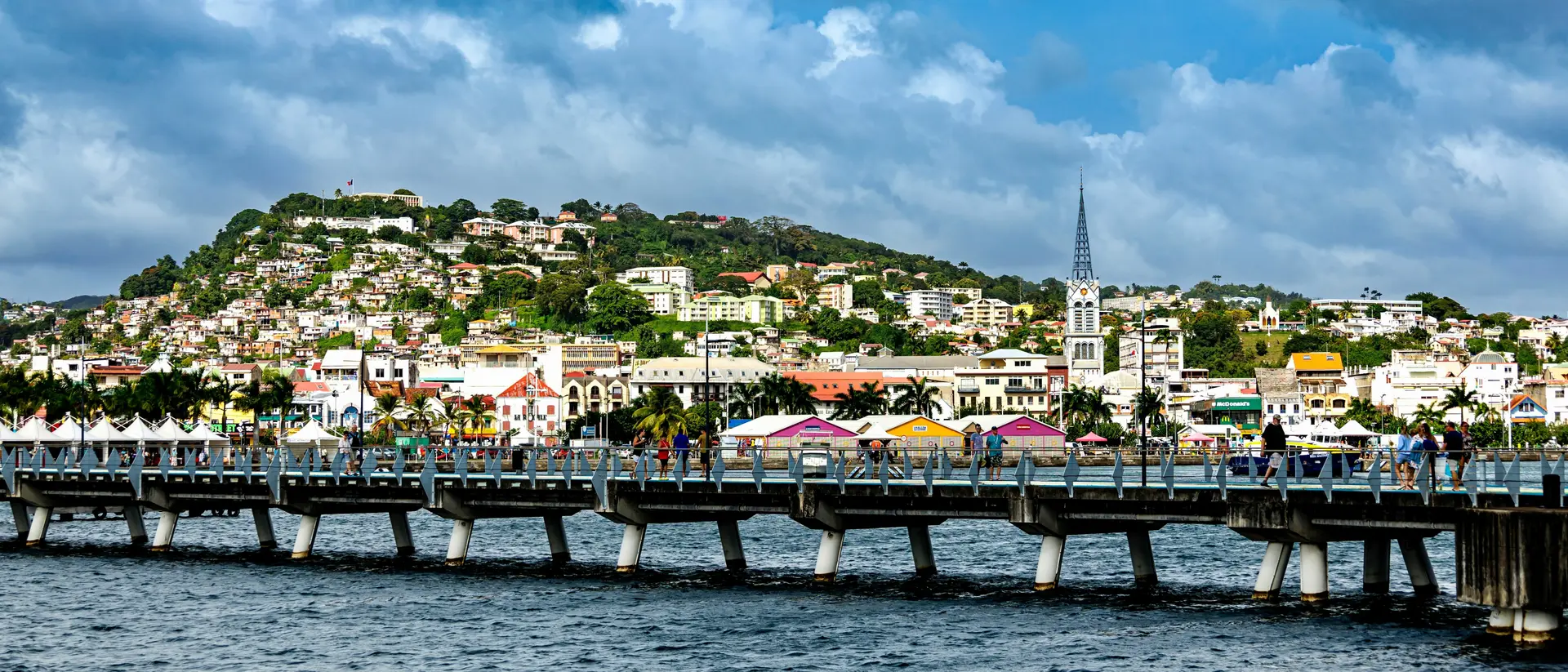 Bridge across the Demerara river toward colorful cityscape of Georgetown in Guyana