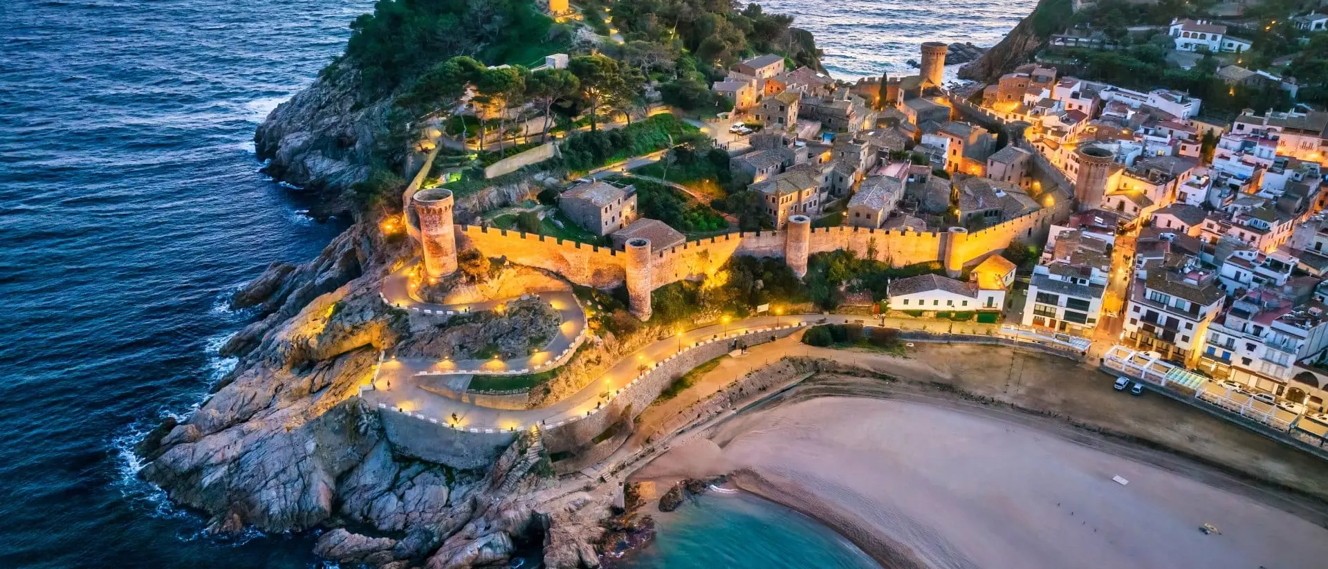 Aerial view of walls of Tossa de Mar in Costa Brava, Catalonia at sunset, Spain