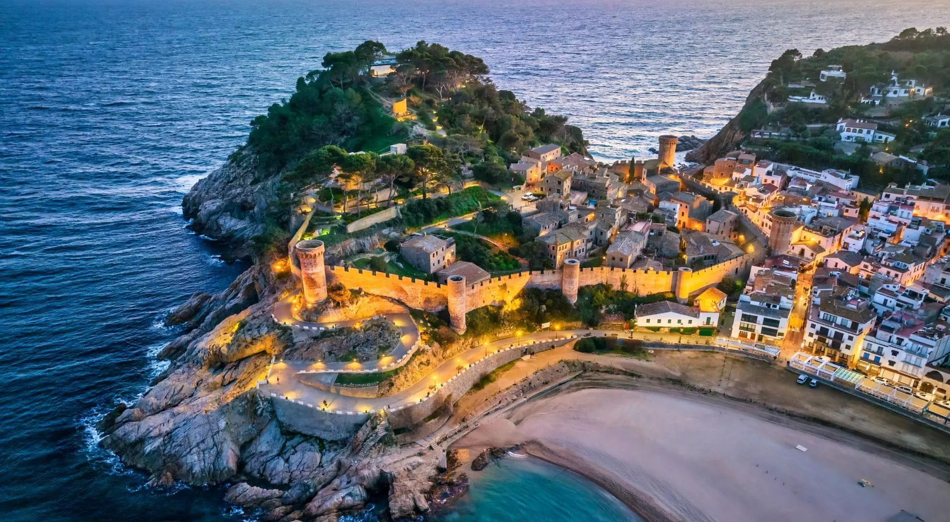 Aerial view of walls of Tossa de Mar in Costa Brava, Catalonia at sunset, Spain