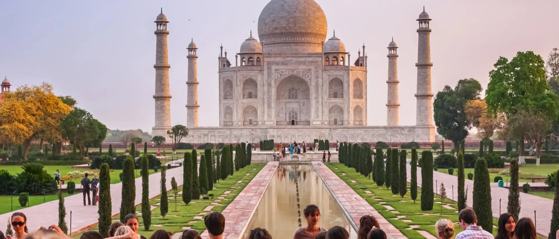 Taj Mahal in Agra, India Group of tourists visit the landmark Taj Mahal in Agra, India